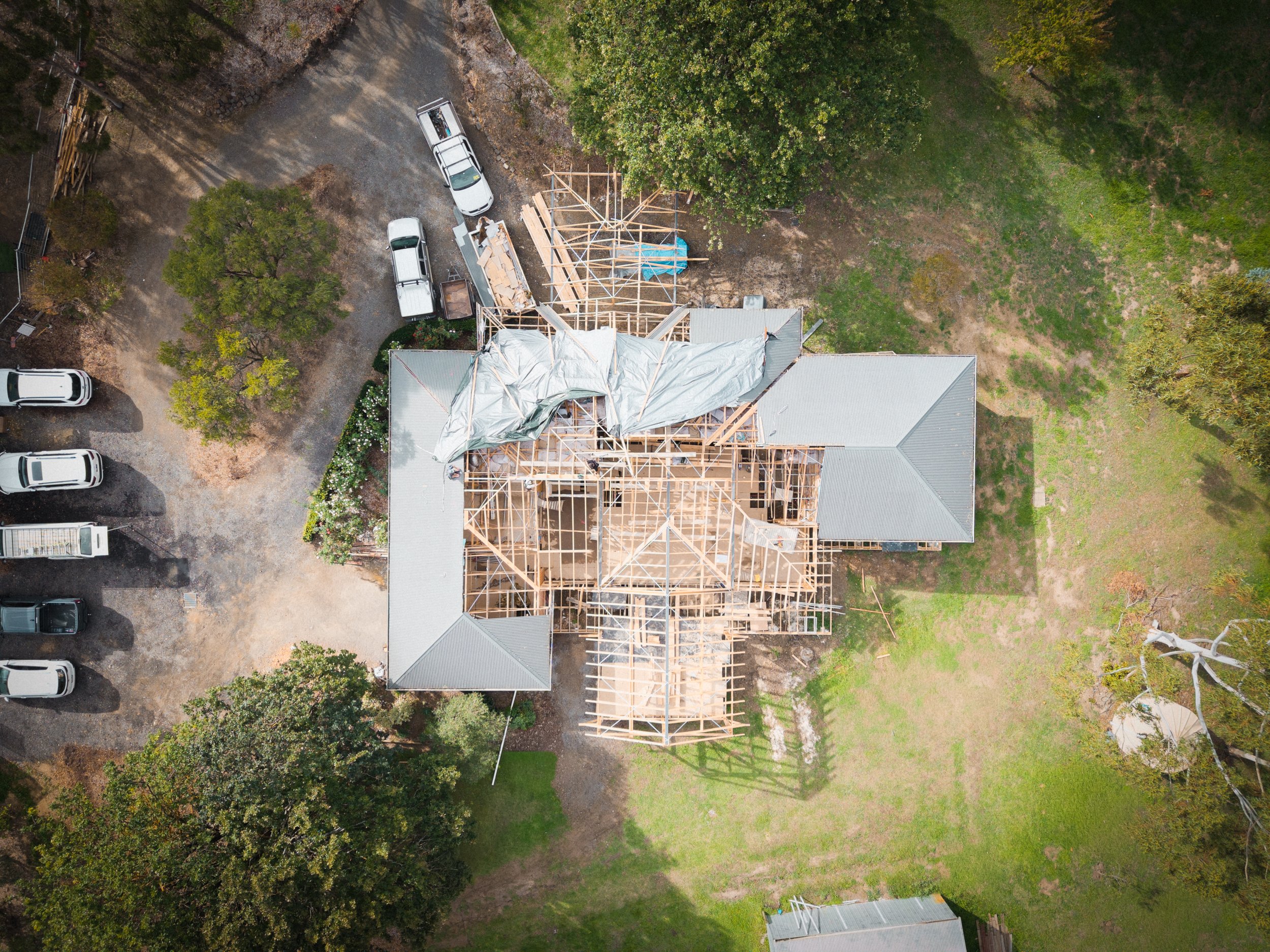 Aerial view of a house under construction, with wooden framing in Yarra Valley built by Leisure Built 