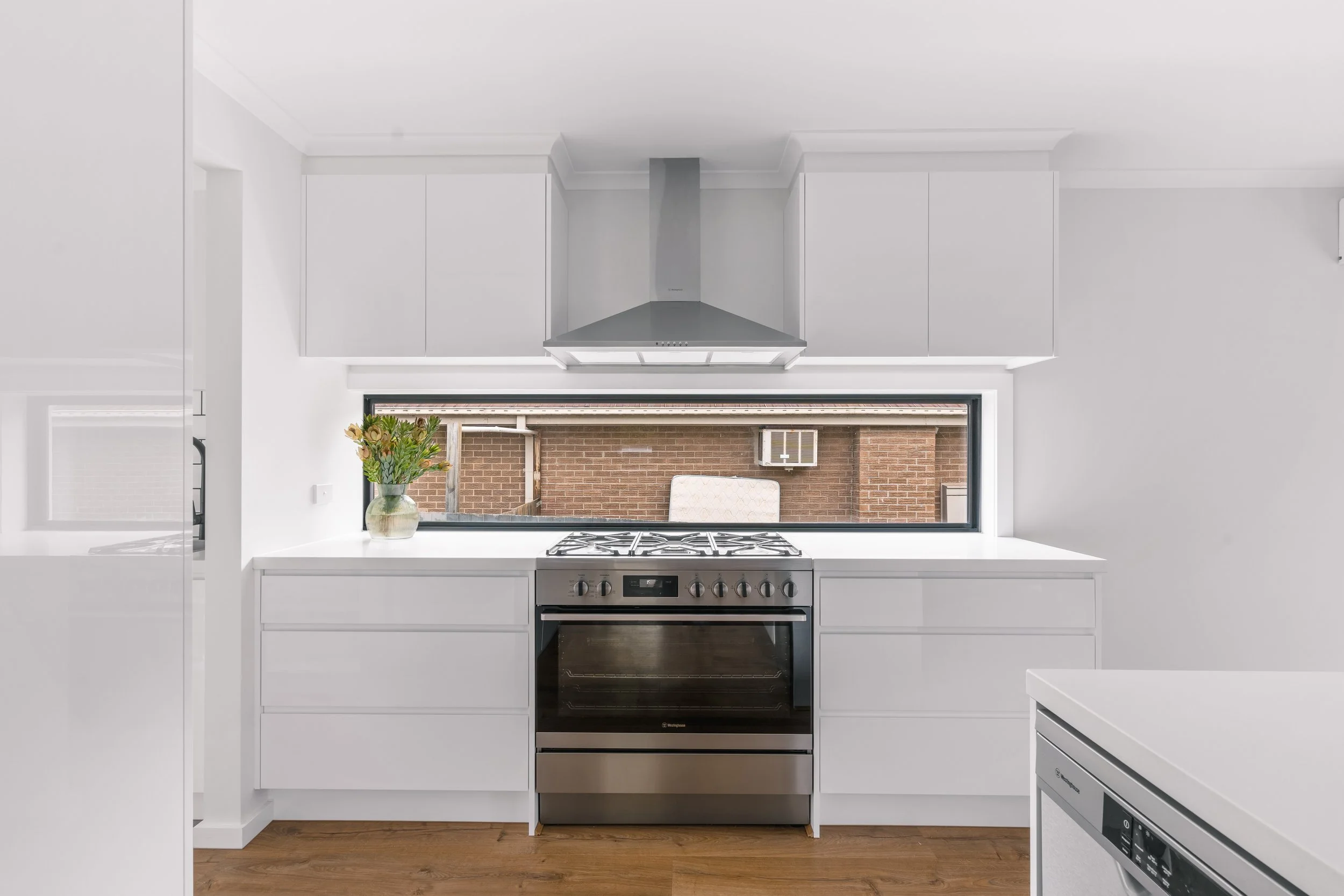 Modern white kitchen in Yarra Valley built by Leisure Built