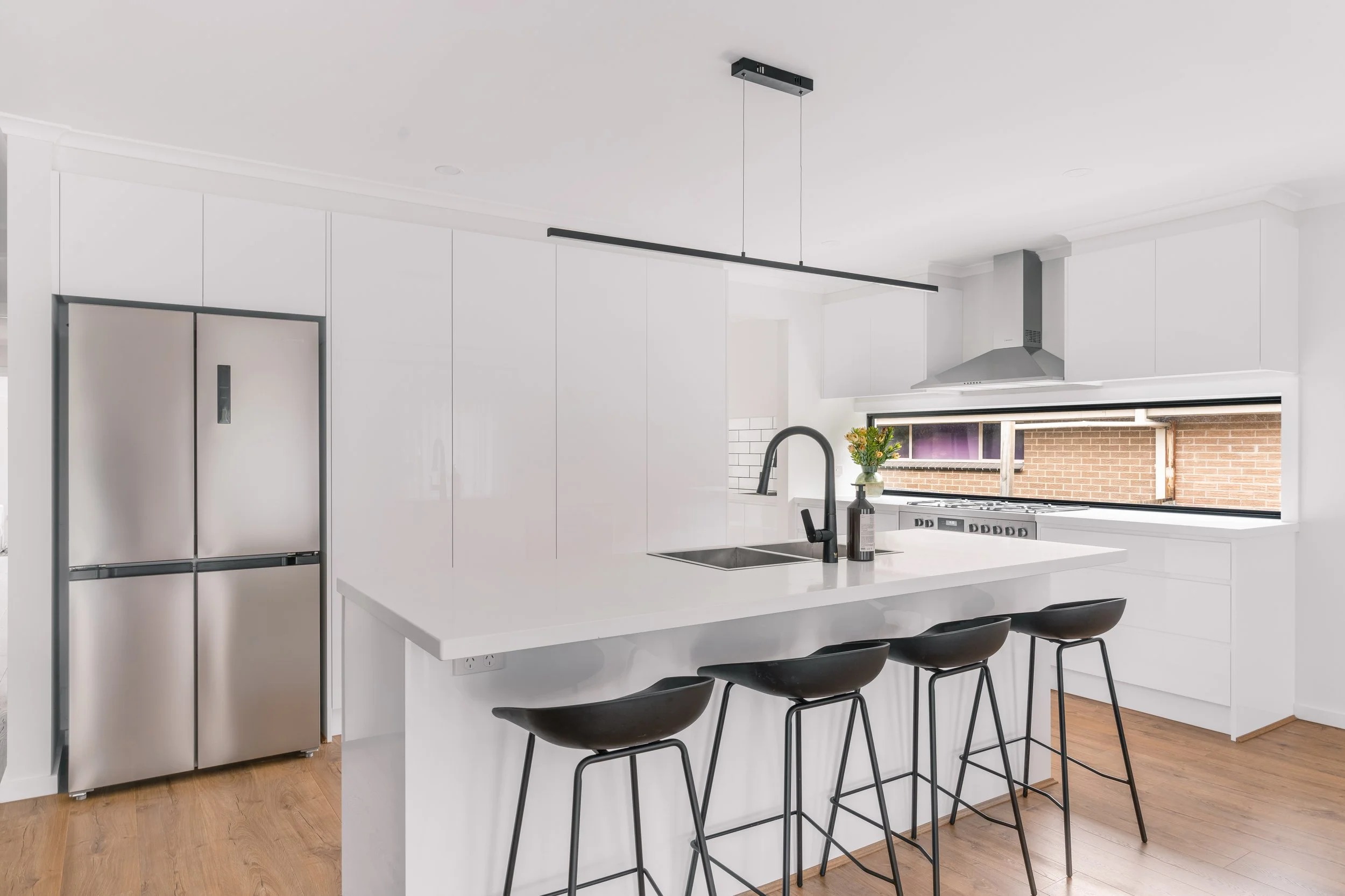 Modern white kitchen in Yarra Valley built by Leisure Built
