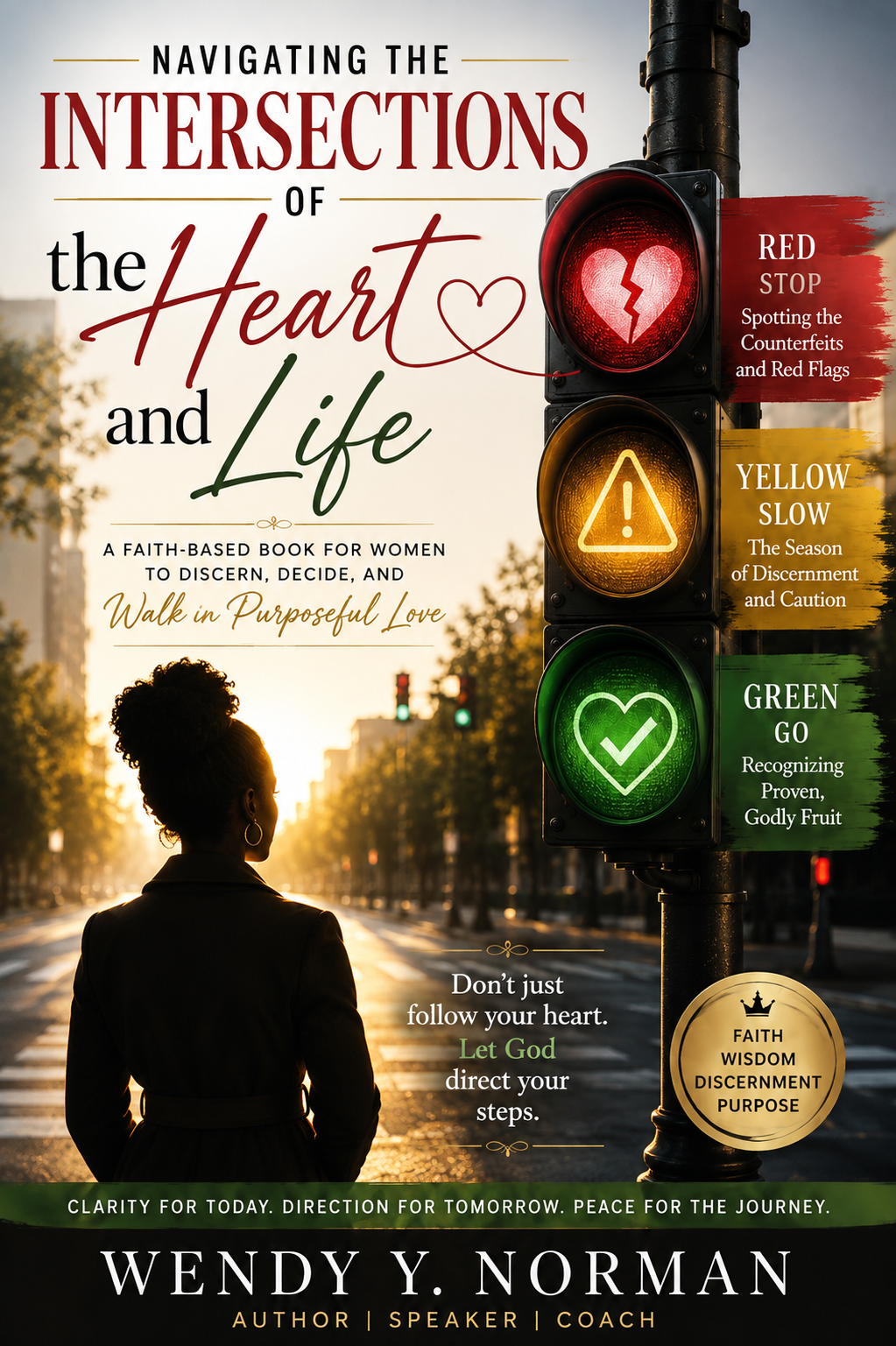 Book cover titled 'Navigating the Intersections of the Heart and Life' by Wendy Y. Norman. Features a woman with a ponytail in a suit, standing at a city crosswalk during sunset, with a traffic light showing red, yellow, and green signals with symbols representing caution, warning, and go. The cover emphasizes discernment, purpose, and trusting God's guidance.