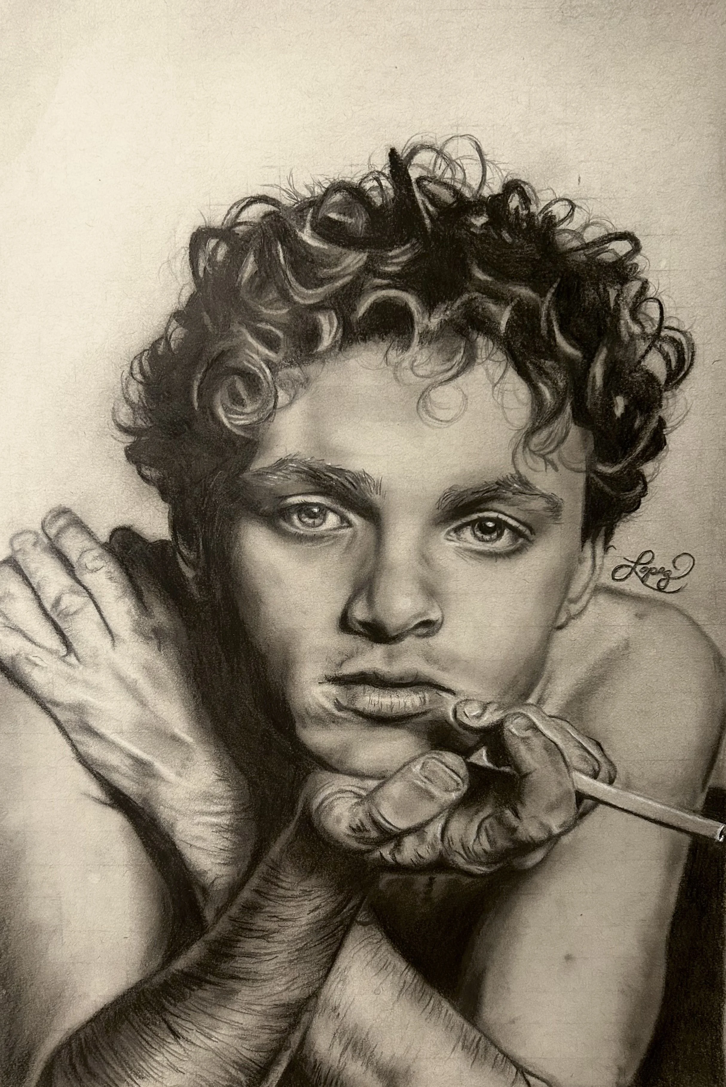 A detailed black and white portrait drawing of a man with curly hair and intense eyes, holding his hands near his face, with an expressive and artistic style.