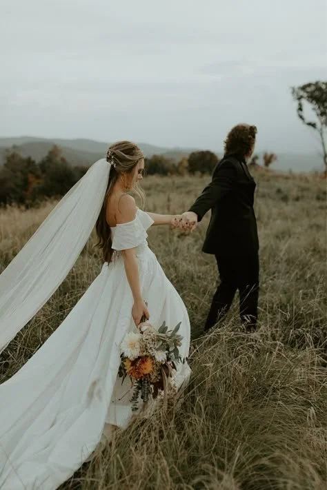 Bride and groom holding hands during a wedding ceremony in British Columbia
