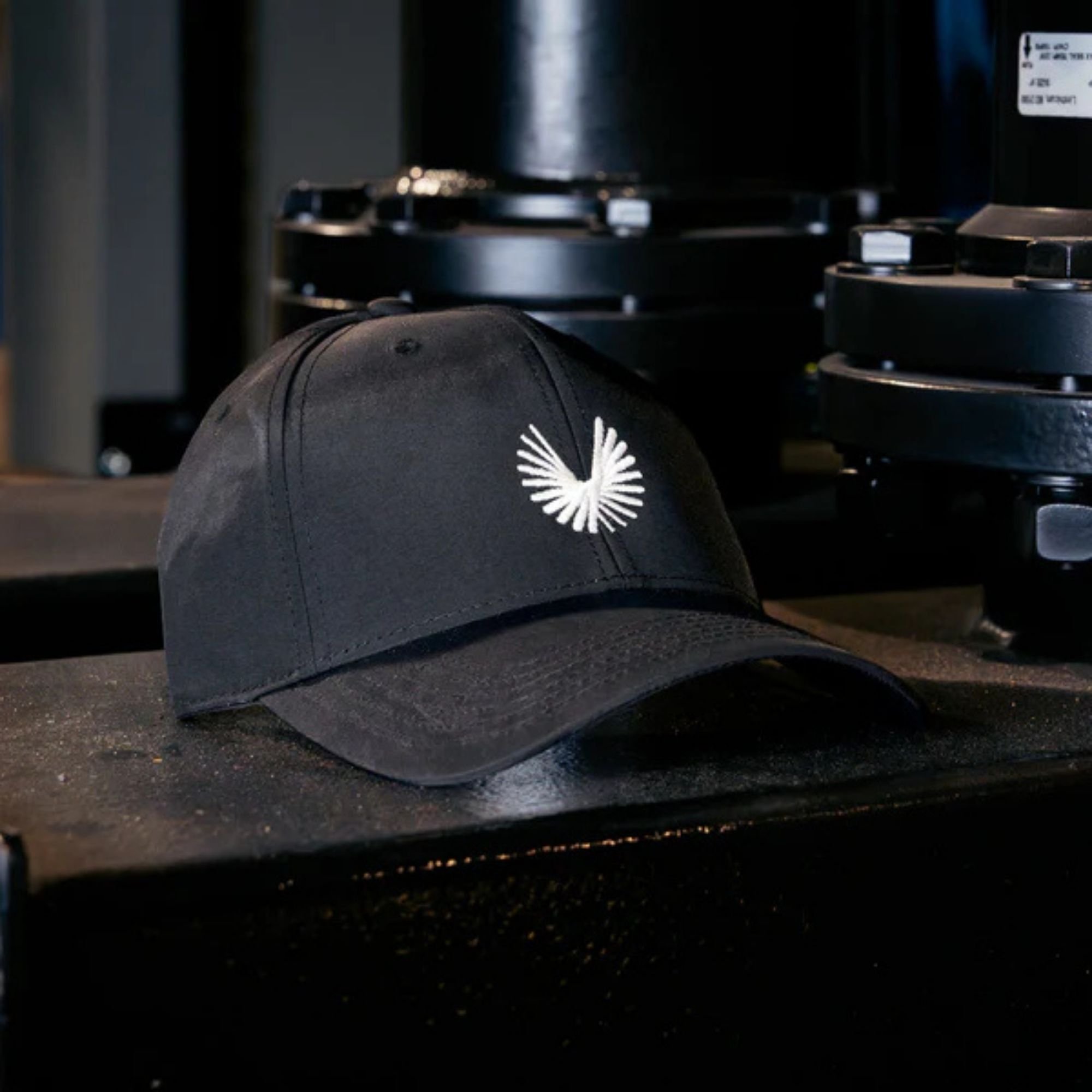 A black baseball cap with the Boom Supersonic logo.
