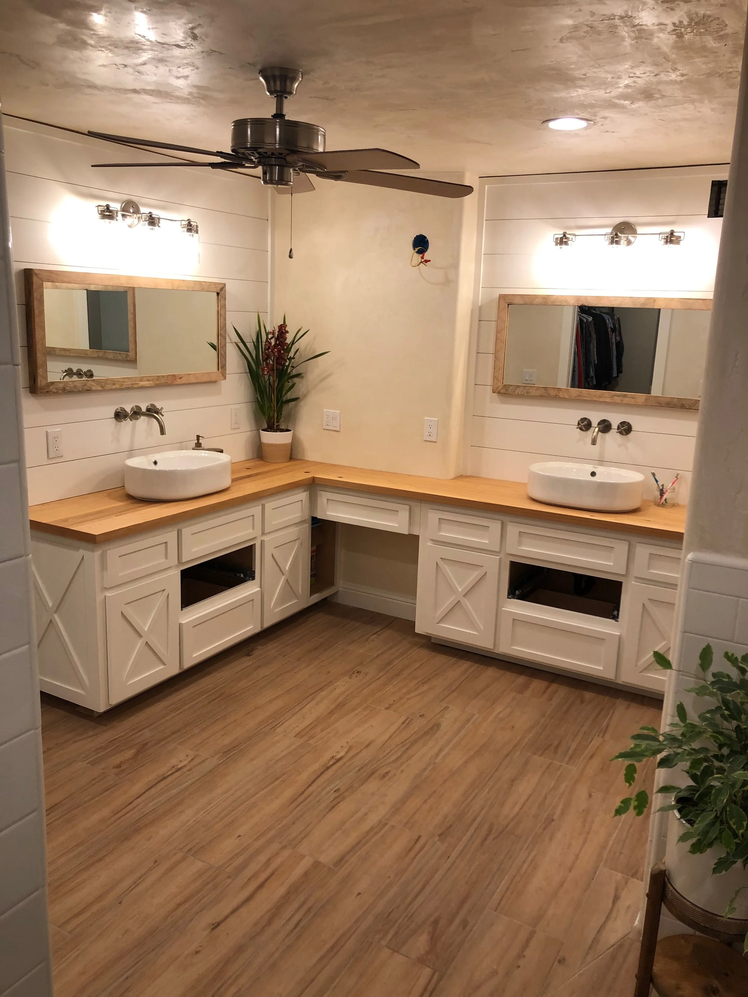 Custom ranch-style cabinets in a bathroom with modern sinks and fixtures designed and built by Valley Mill Shop in Monterey, California