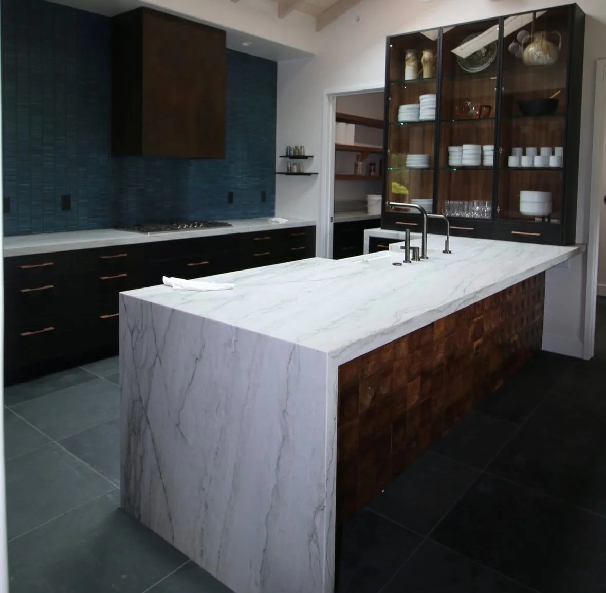 Custom bar island with marble sides and top
