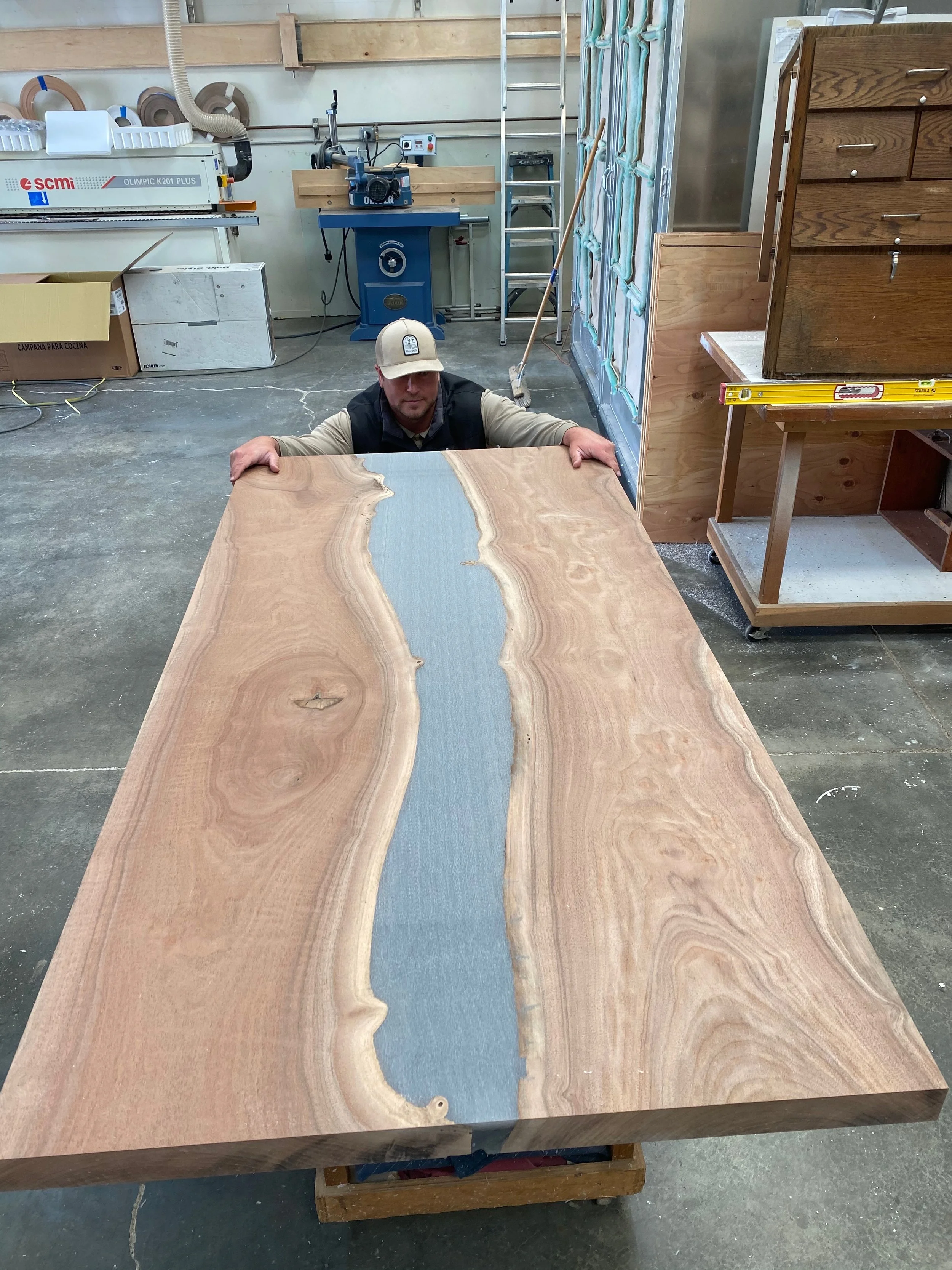 Large custom epoxy-poured redwood table in Carmel Valley, California created by Valley Mill Shop