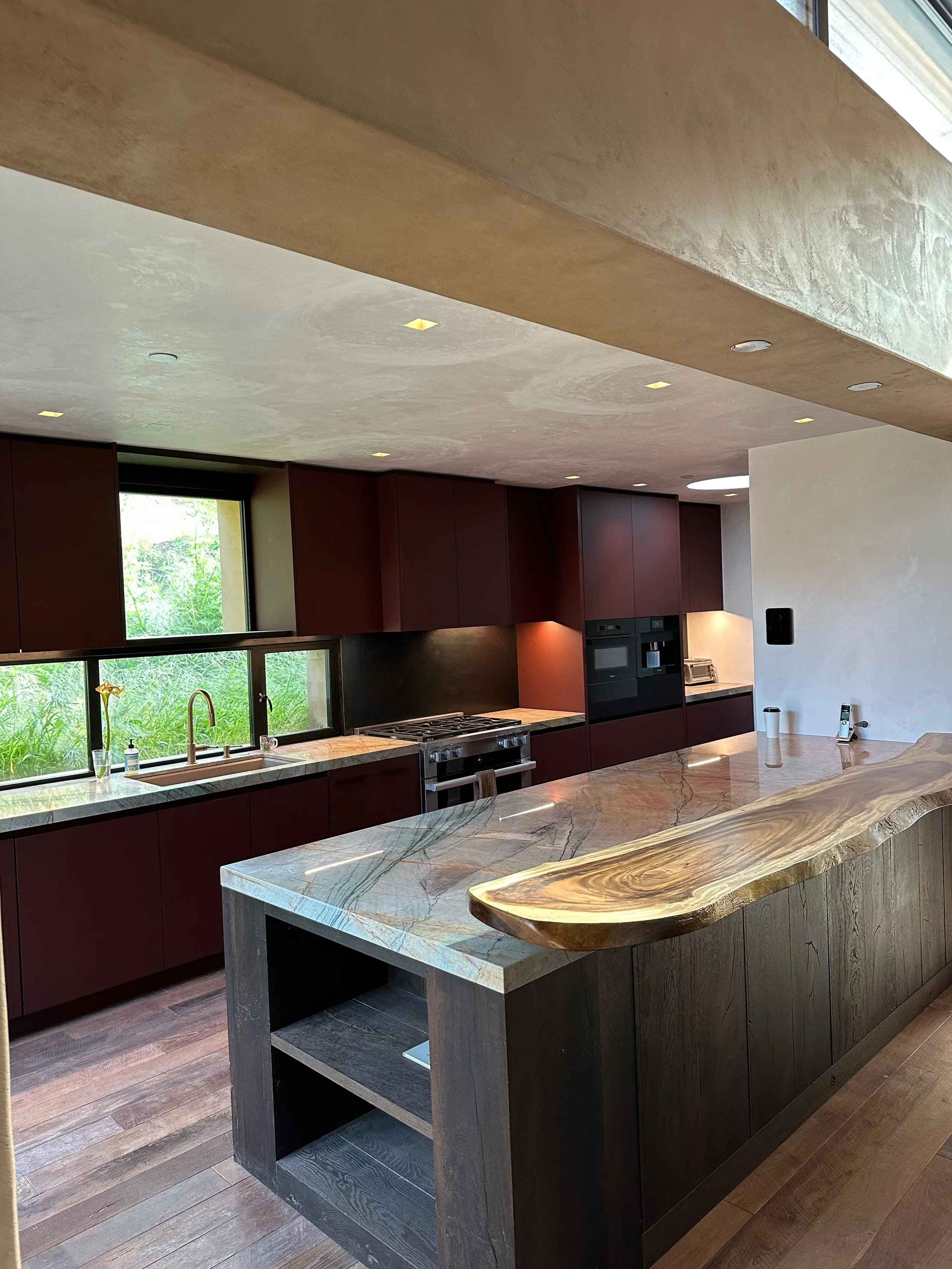 Custom kitchen island with grey granite countertop in Carmel California