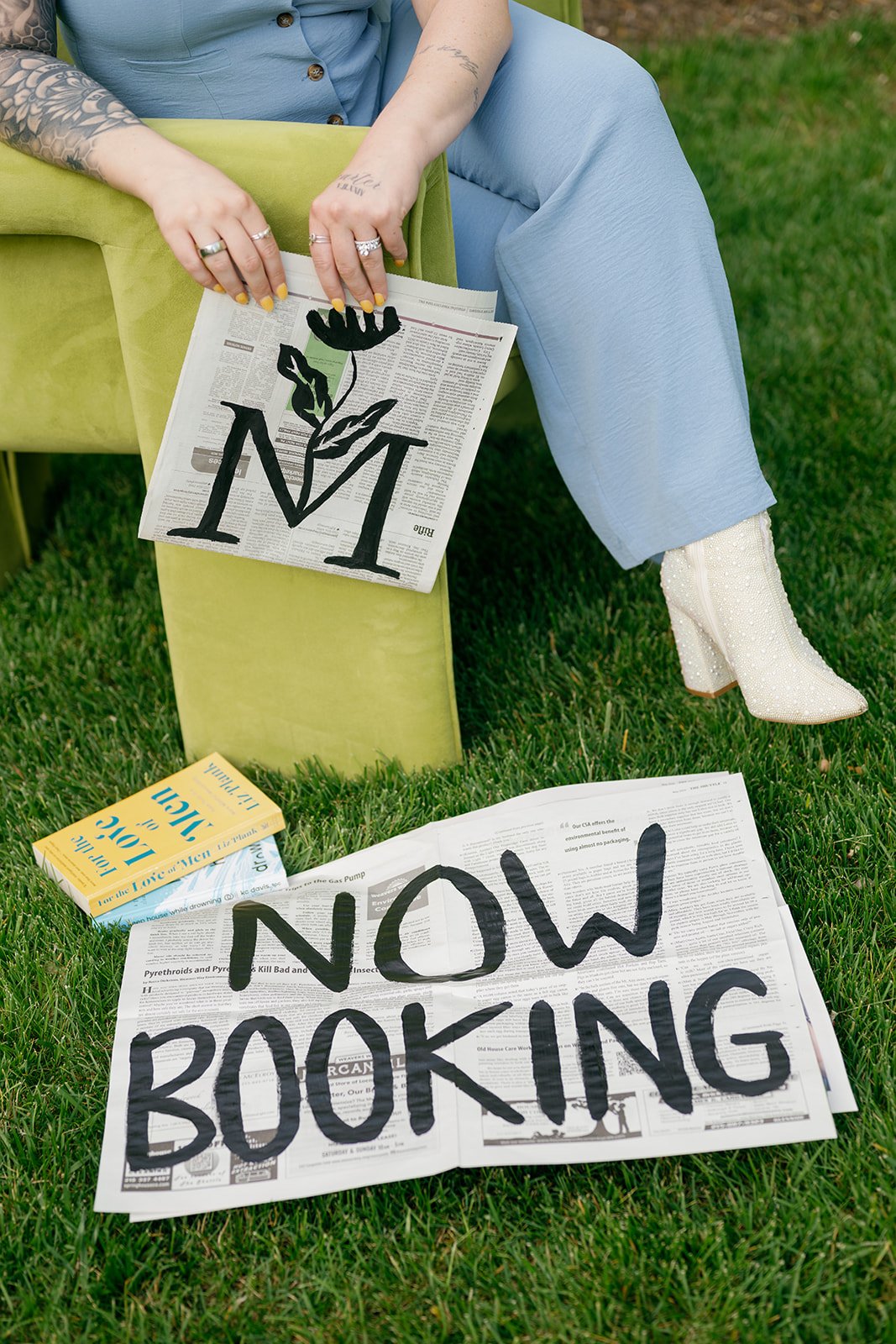 Sabrina with now booking newspaper