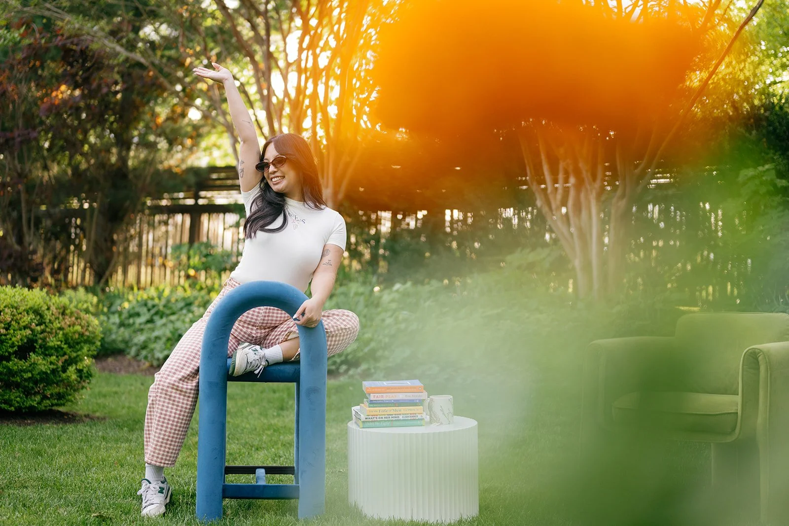 Ana Macaspac therapist posing with books and marigolds
