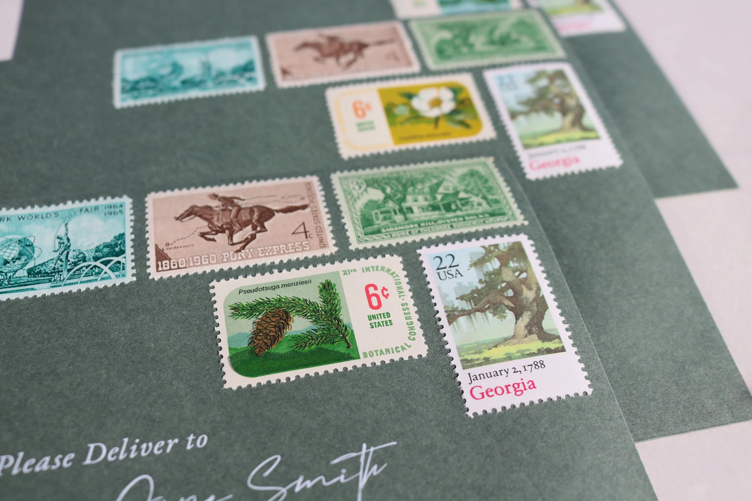 A collection of colorful vintage postage stamps on a dark background.