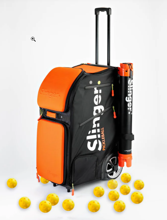A black and orange pickleball equipment bag with a telescoping handle, surrounded by yellow pickleballs on a white background.