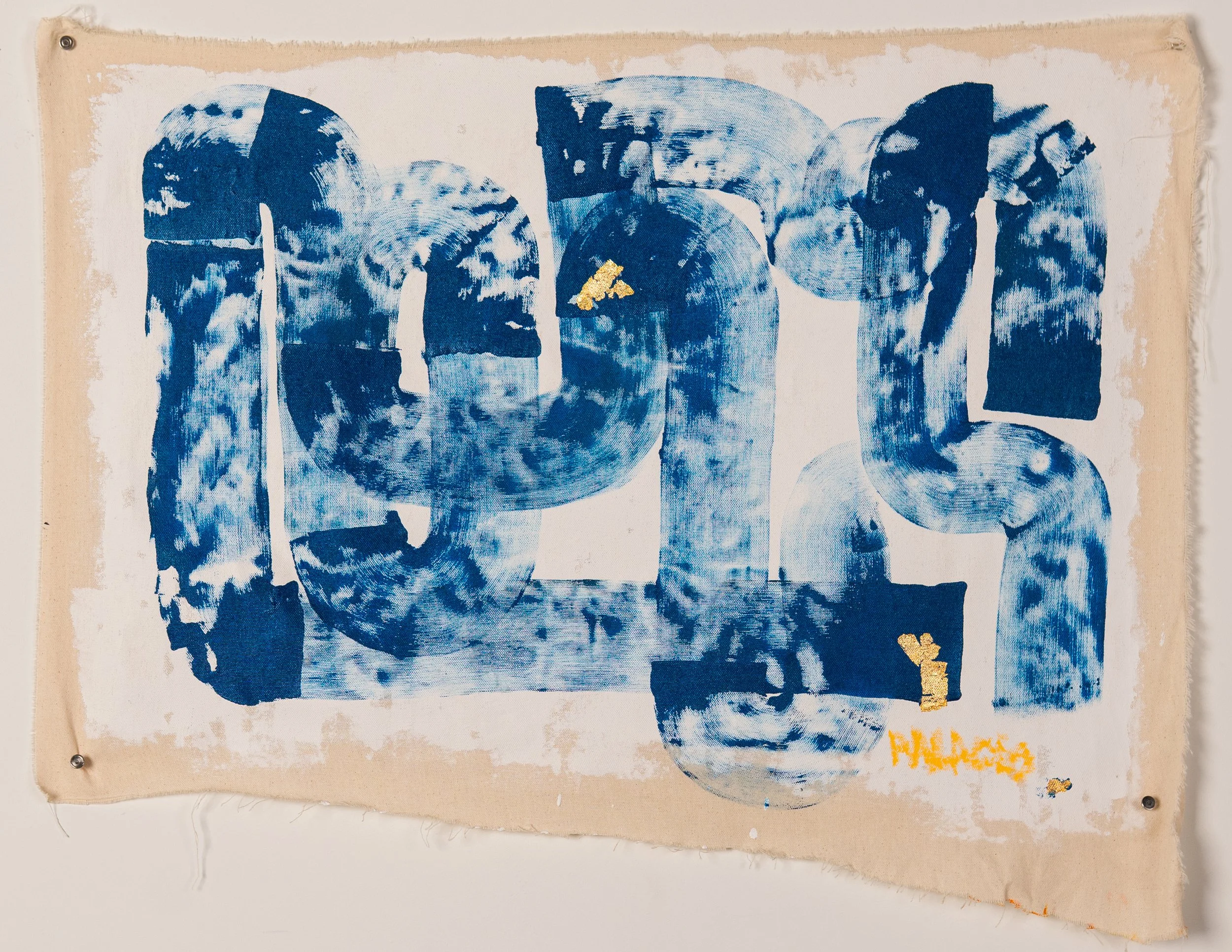 Blue abstract artwork on fabric with some gold-colored markings and the word "PEACE" in orange at the bottom right corner.