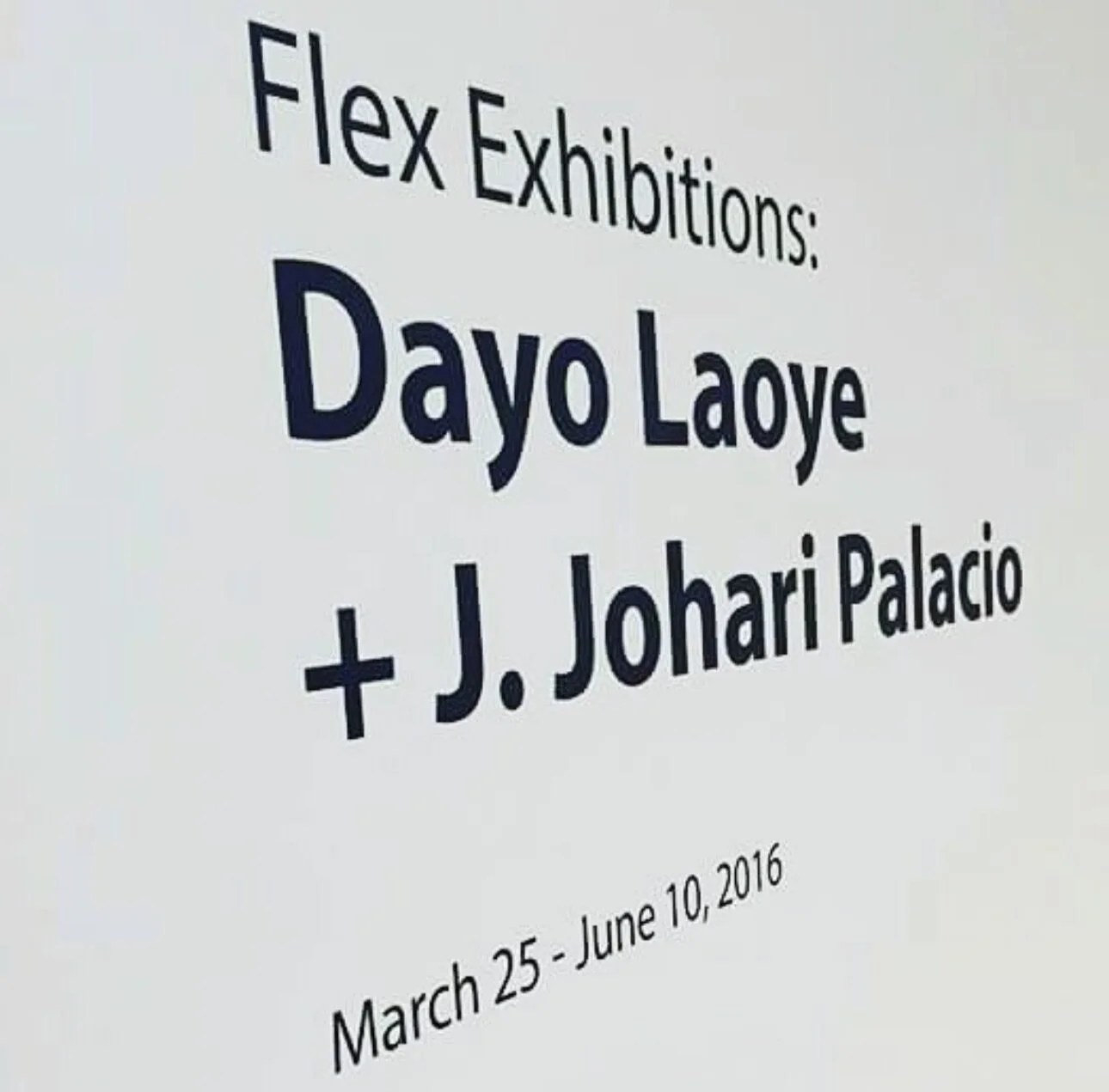 Signboard advertising the 'Flex Exhibitions' featuring artist Dayo Laoye and J. Johari Palacio, with exhibition dates from March 25 to June 10, 2016.