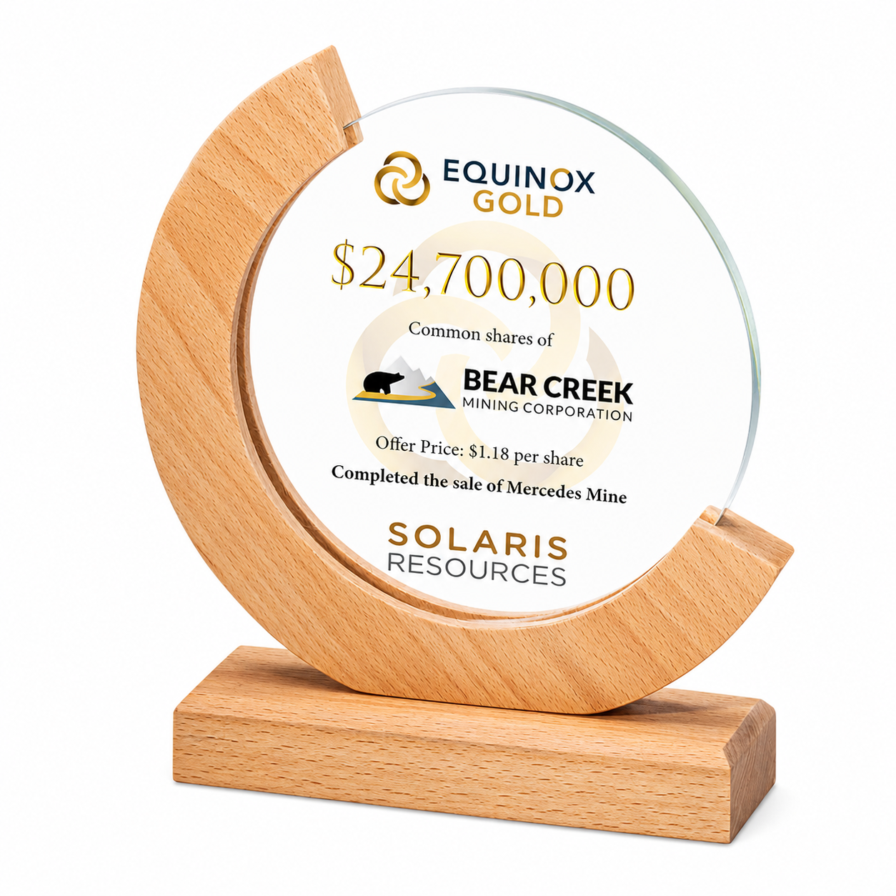 A decorative plaque with a wooden base and glass face featuring an investment certificate for Equinox Gold, valued at $24,700,000, representing common shares of Bear Creek Mining Corporation, with an offer price of $1.18 per share, and noting the sale of Mercedes Mine by Solaris Resources.