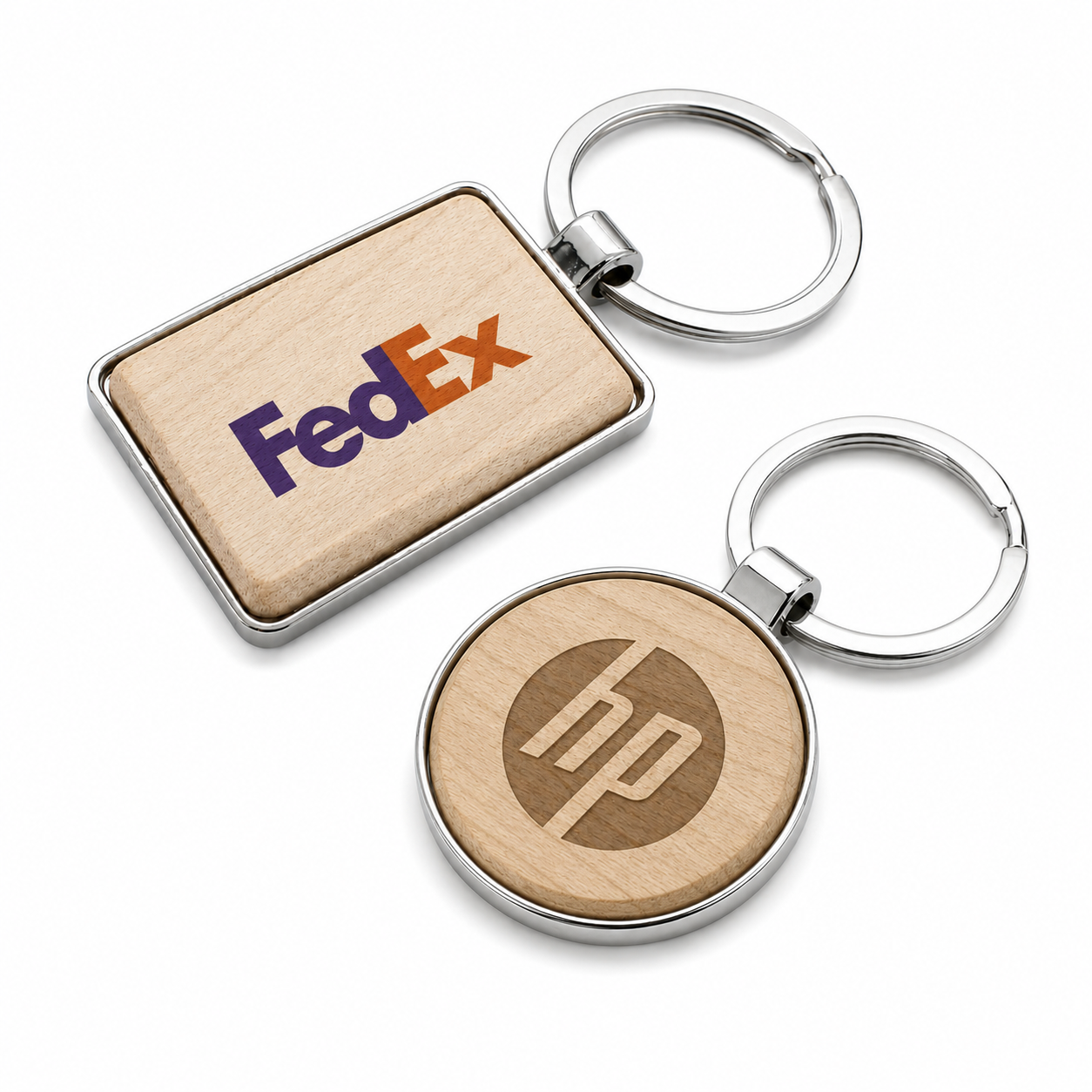 Custom wood and metal keychains with engraved and full-color company logo branding in round and rectangle styles. Personalized keychains for corporate gifts, promotional products, employee appreciation, trade shows, and branded giveaways.