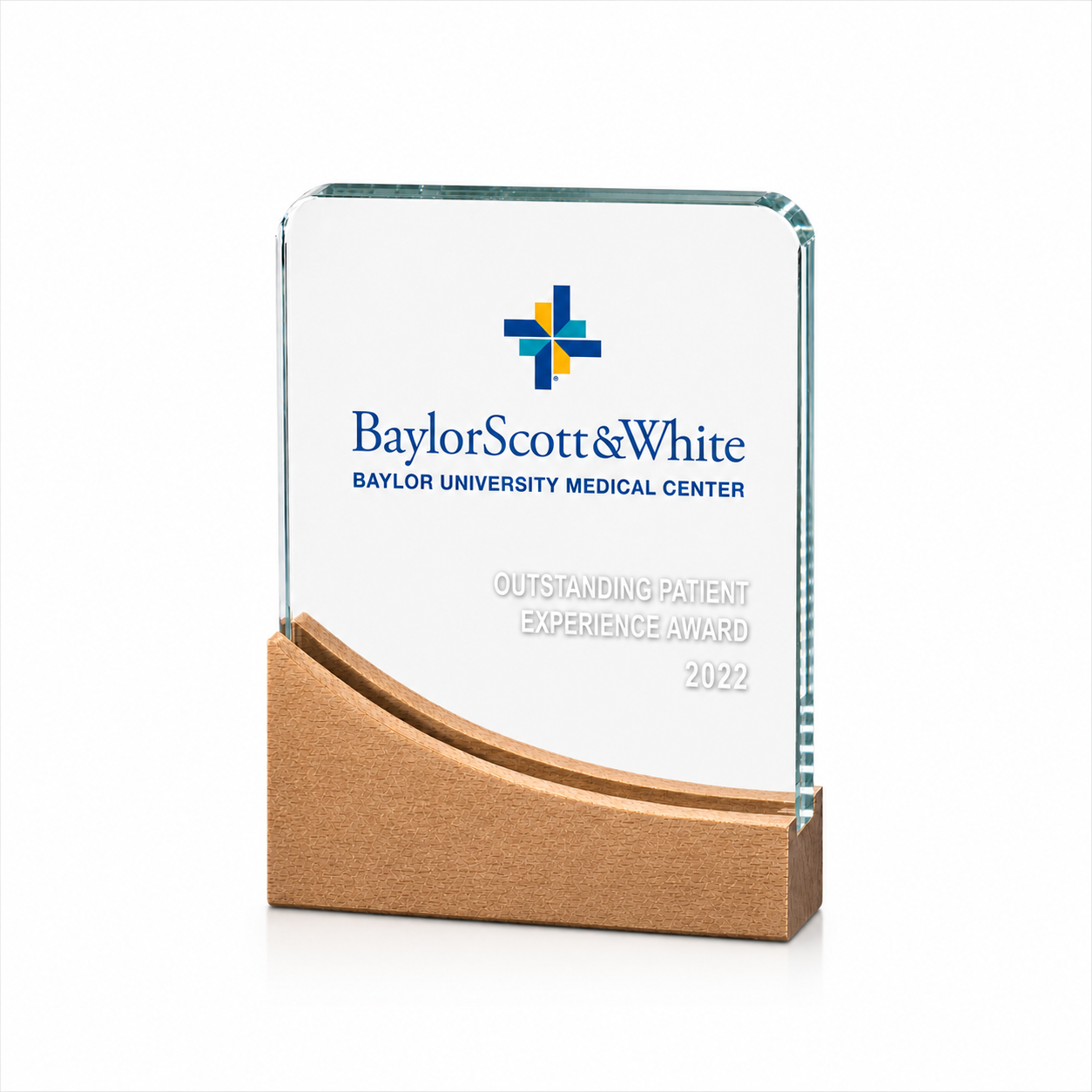 Glass award with the Baylor Scott & White logo and text reading 'Outstanding Patient Experience Award 2022', mounted on a wooden base.
