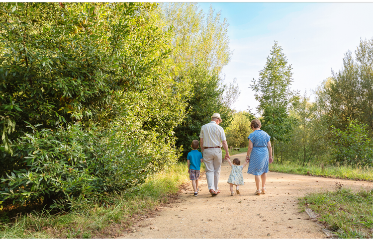 Multi-generational family embracing at home