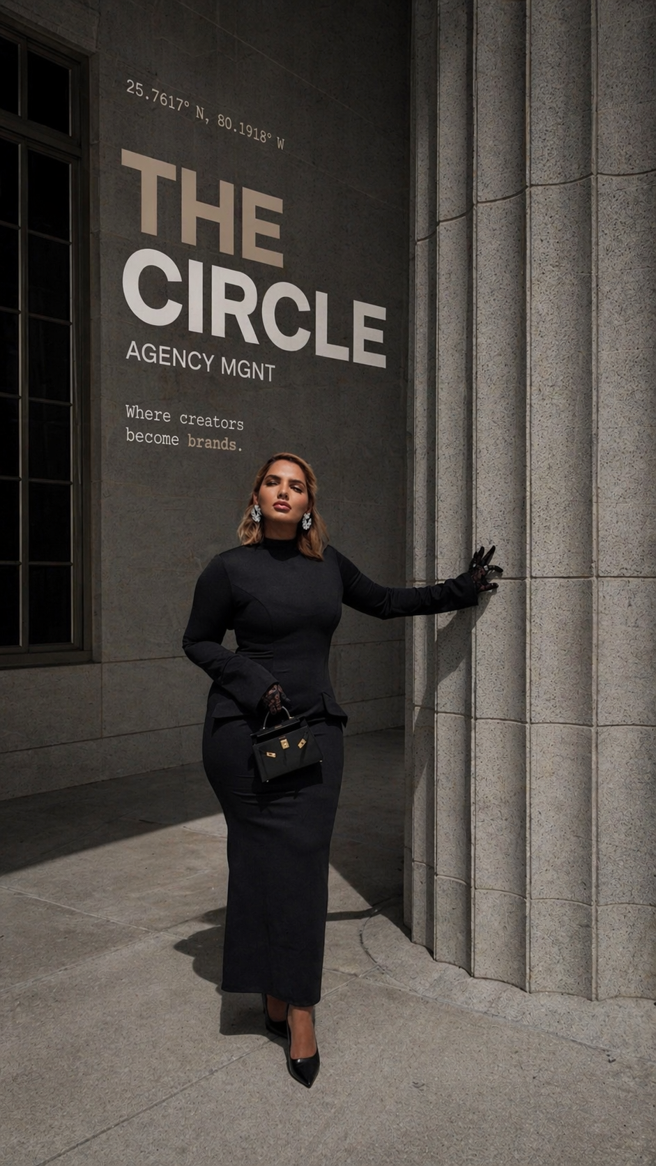 A woman dressed in a black gown standing outside a building in front of a wall with large text that reads 'THE CIRCLE AGENCY MGMT' and smaller text that says 'Where creators become brands.' She is holding a small black handbag, wearing black gloves with lace details, and standing near a stone column.