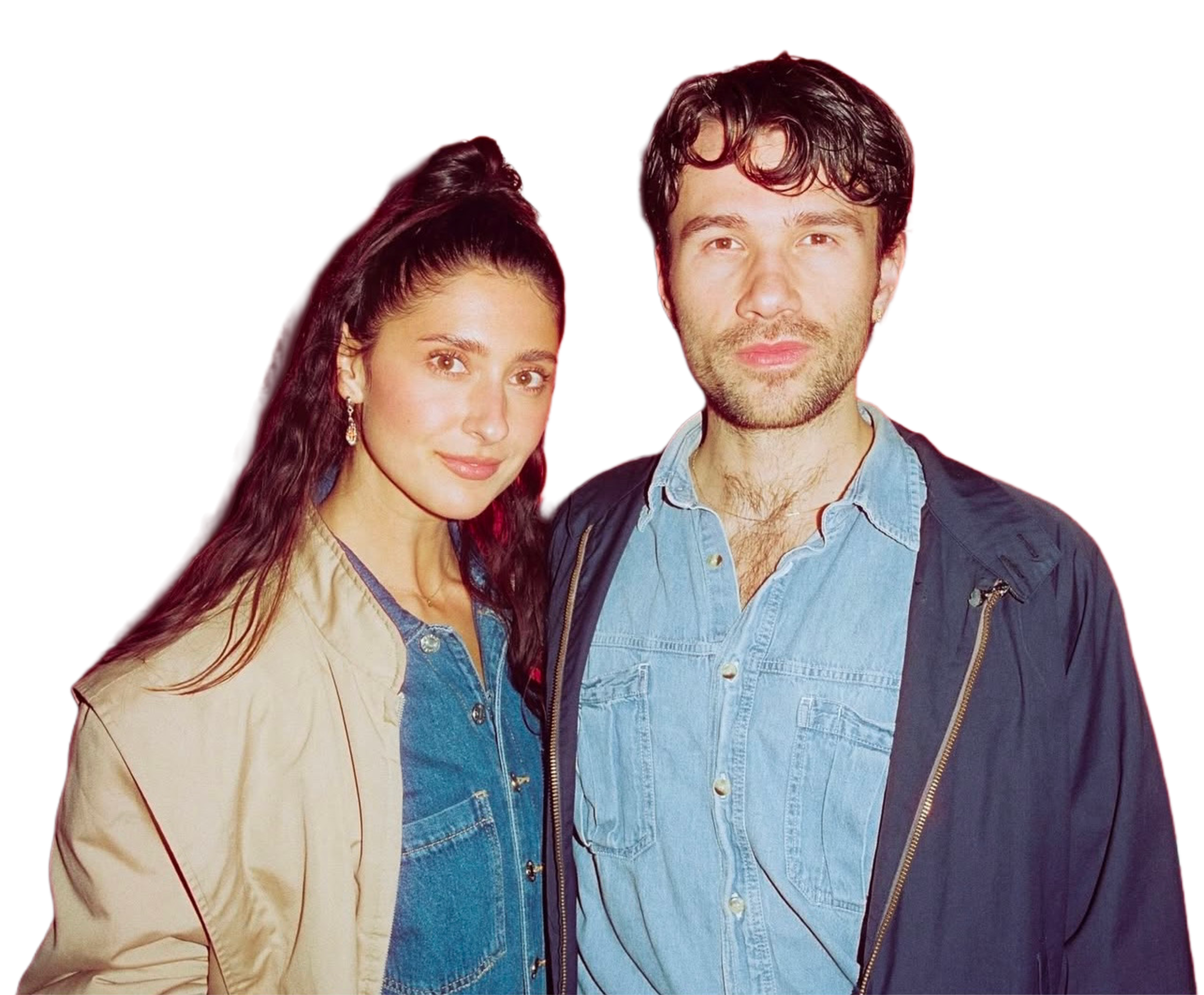 Two young adults, a woman with long dark hair and a man with short curly hair, standing close together against a modern digital background