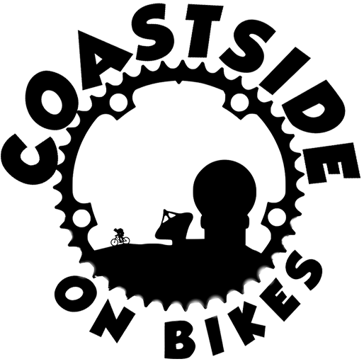 Logo for Coastside On Bikes featuring a large gear with the text 'Coastside On Bikes around it.