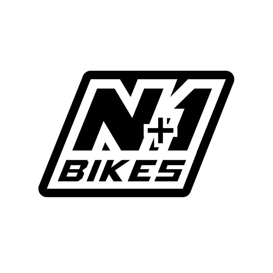 Black and white logo for N Plus One Bikes with stylized text and slash graphic.