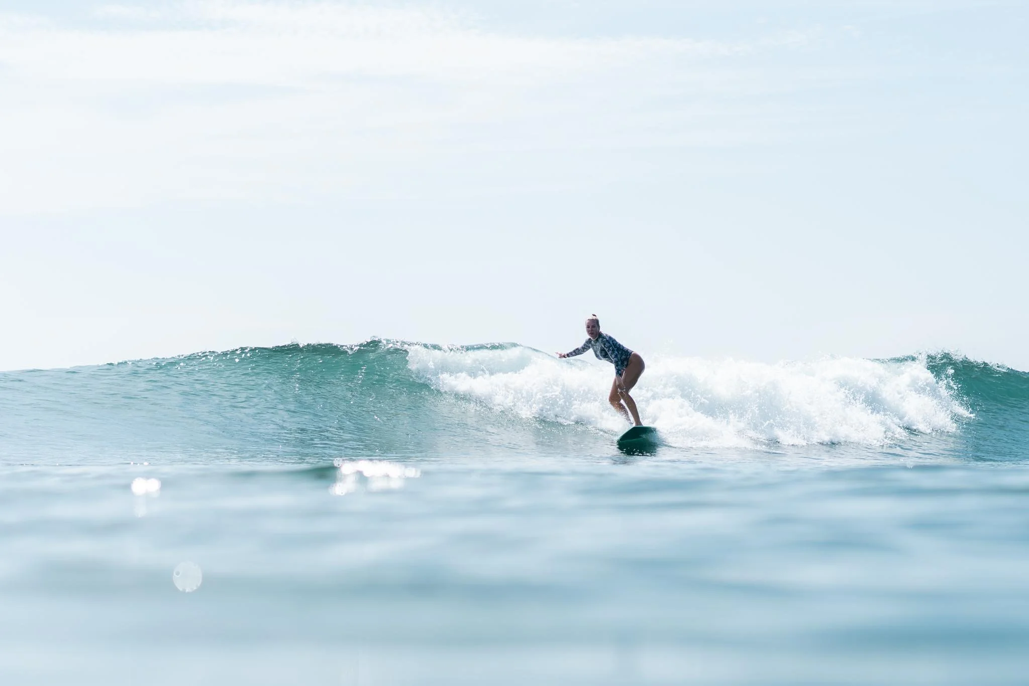 A student surfing in Weligama bay — Lanka Surf House