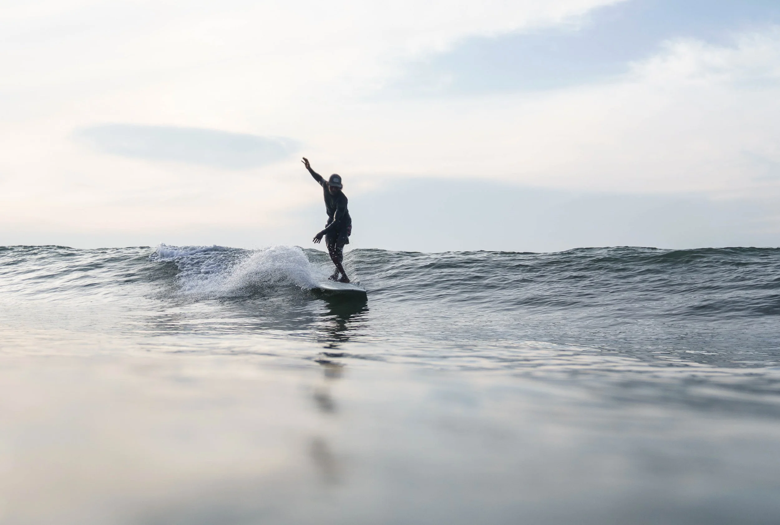 Anju longboarding at Gas Station surf point, Ahangama, Sri Lanka