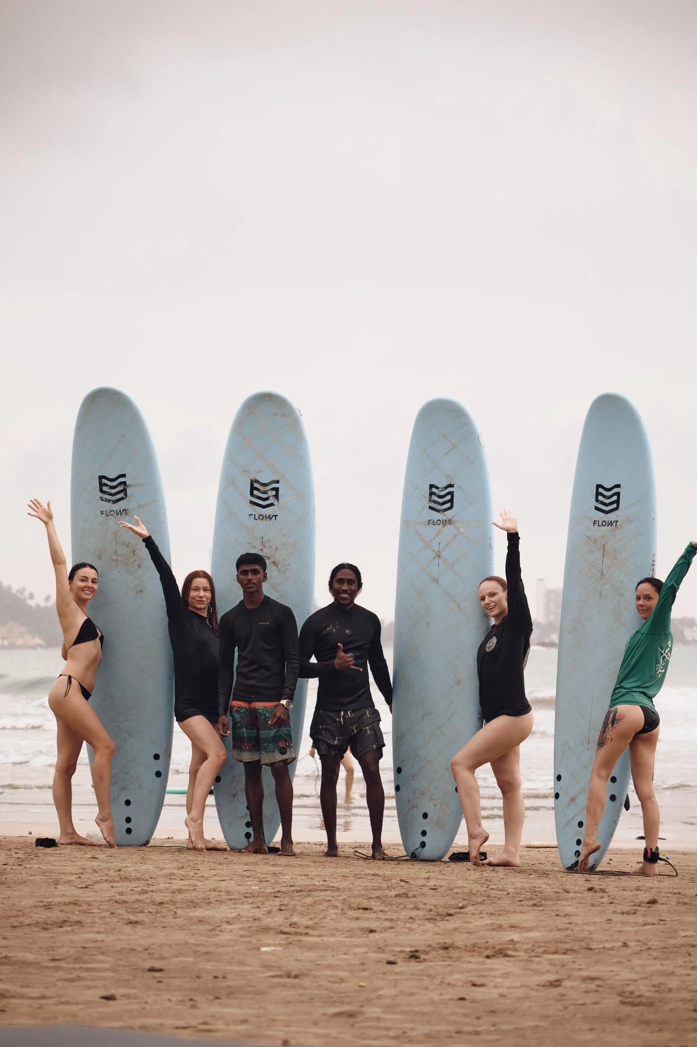 Anju teaching beginner surfers at Weligama Bay, Sri Lanka