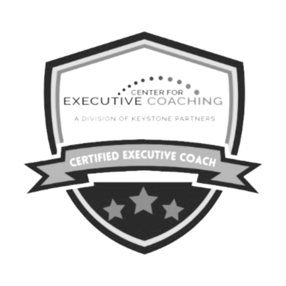 A shield-shaped badge with the text 'Center for Executive Coaching, a division of Keystone Partners,' and a banner reading 'Certified Executive Coach,' featuring three stars at the bottom.