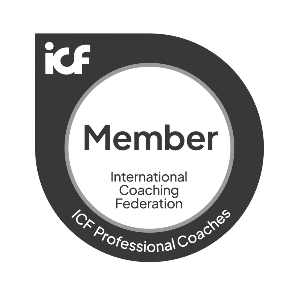 Membership badge for the International Coaching Federation, featuring a circular design with black and grey colors and the text "Member" in the center.