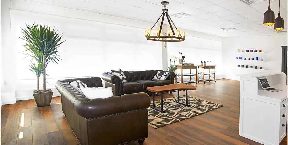 Client lounge with Chesterfield sofas at New York's Face Place