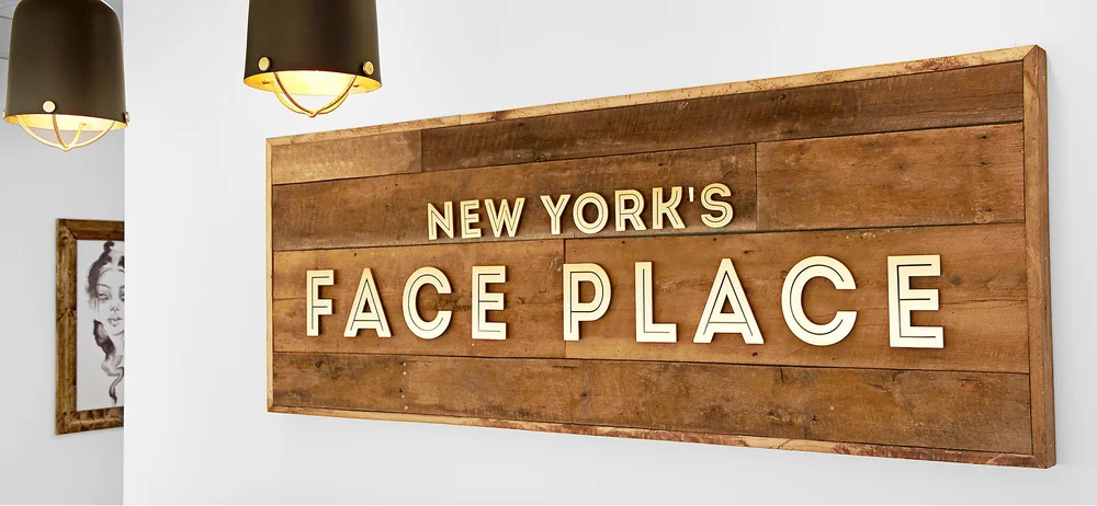 New York's Face Place wooden sign
