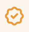 A gold badge or medal with a checkmark in the center.