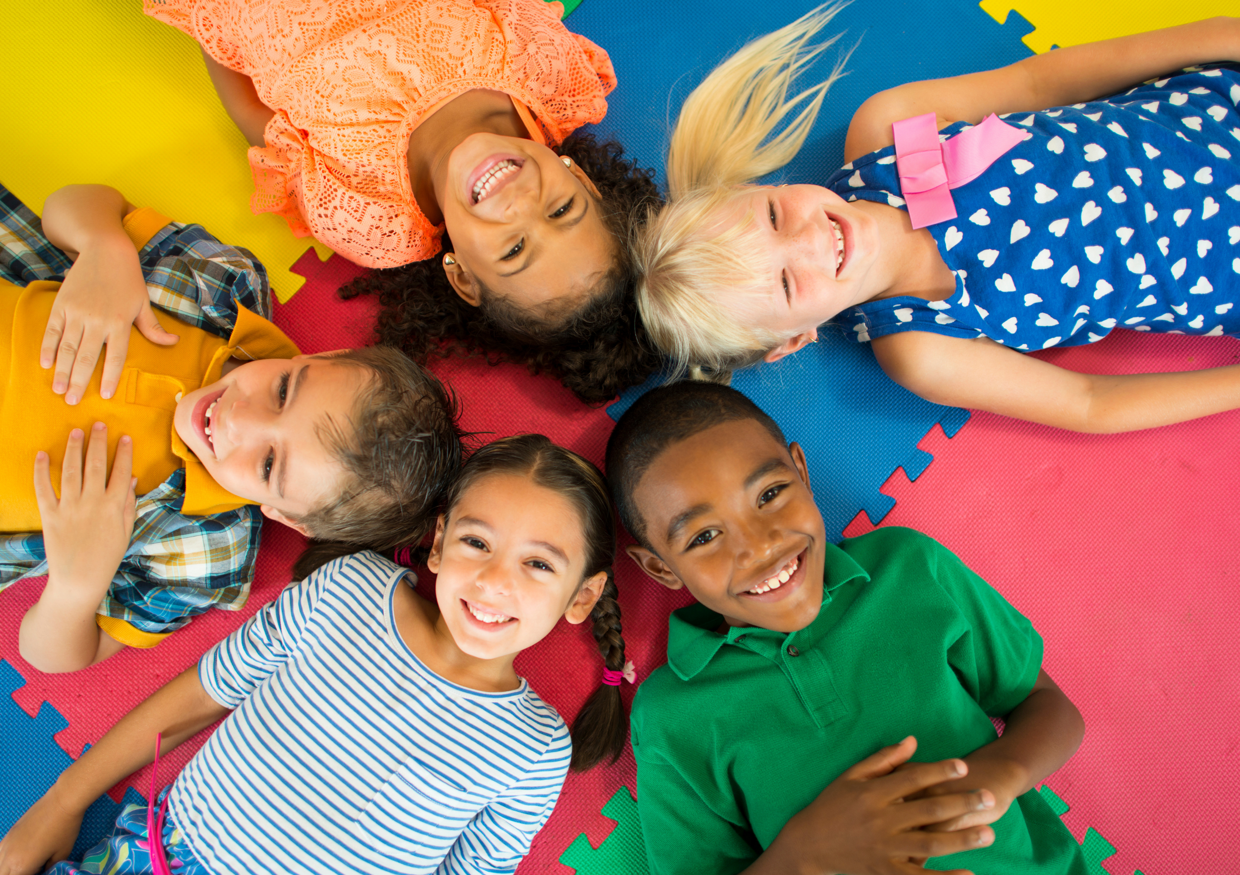 children lying smiling.png
