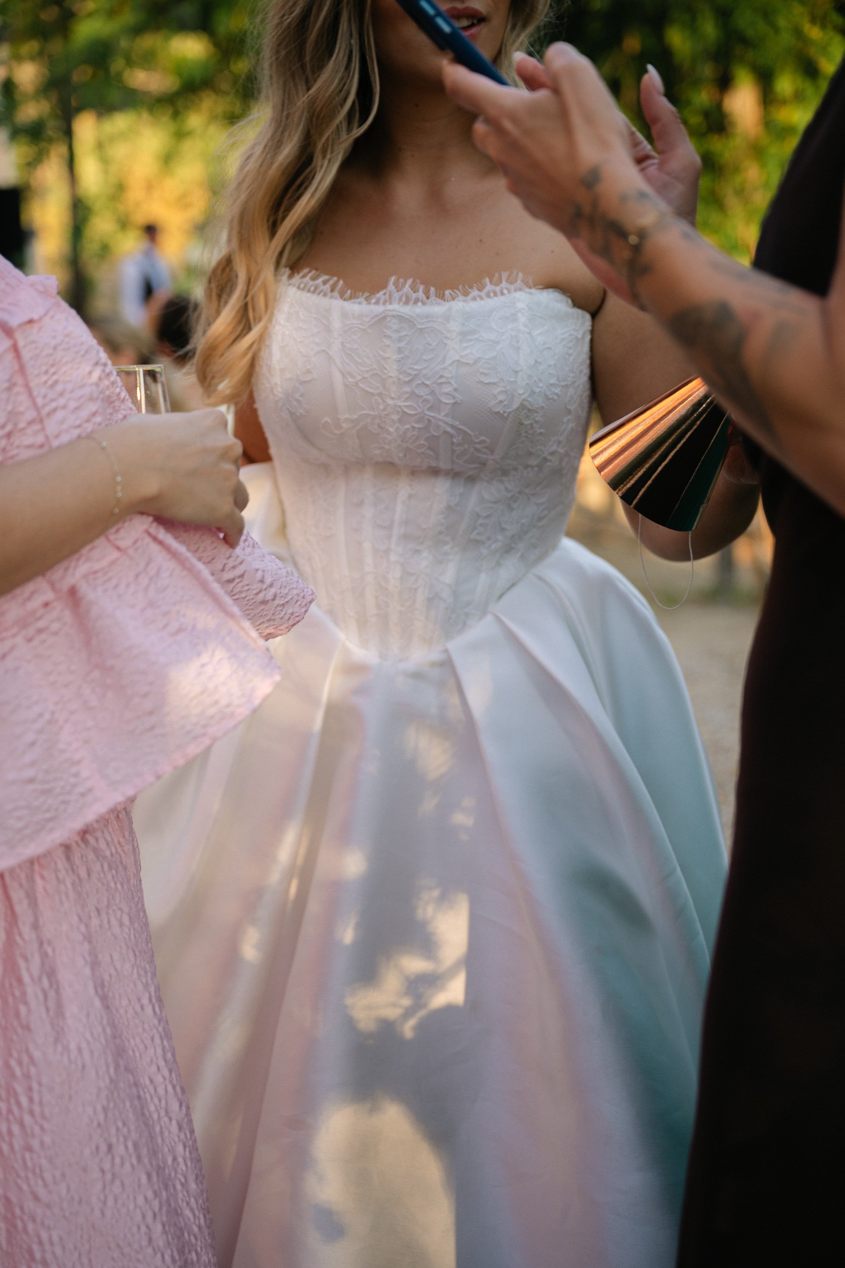 Close detail of the bride's textured bodice at Château de la Valouze