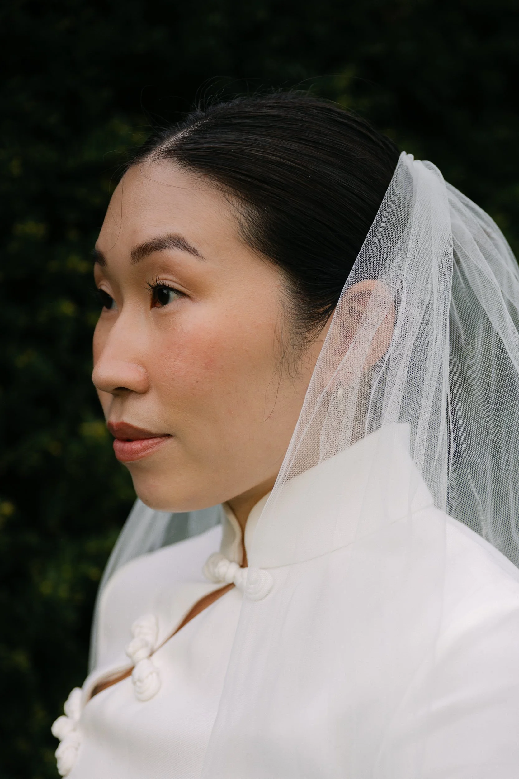 Editorial bridal portrait in a Sau Lee ivory gown and veil, photographed at Brockwell Park in South London