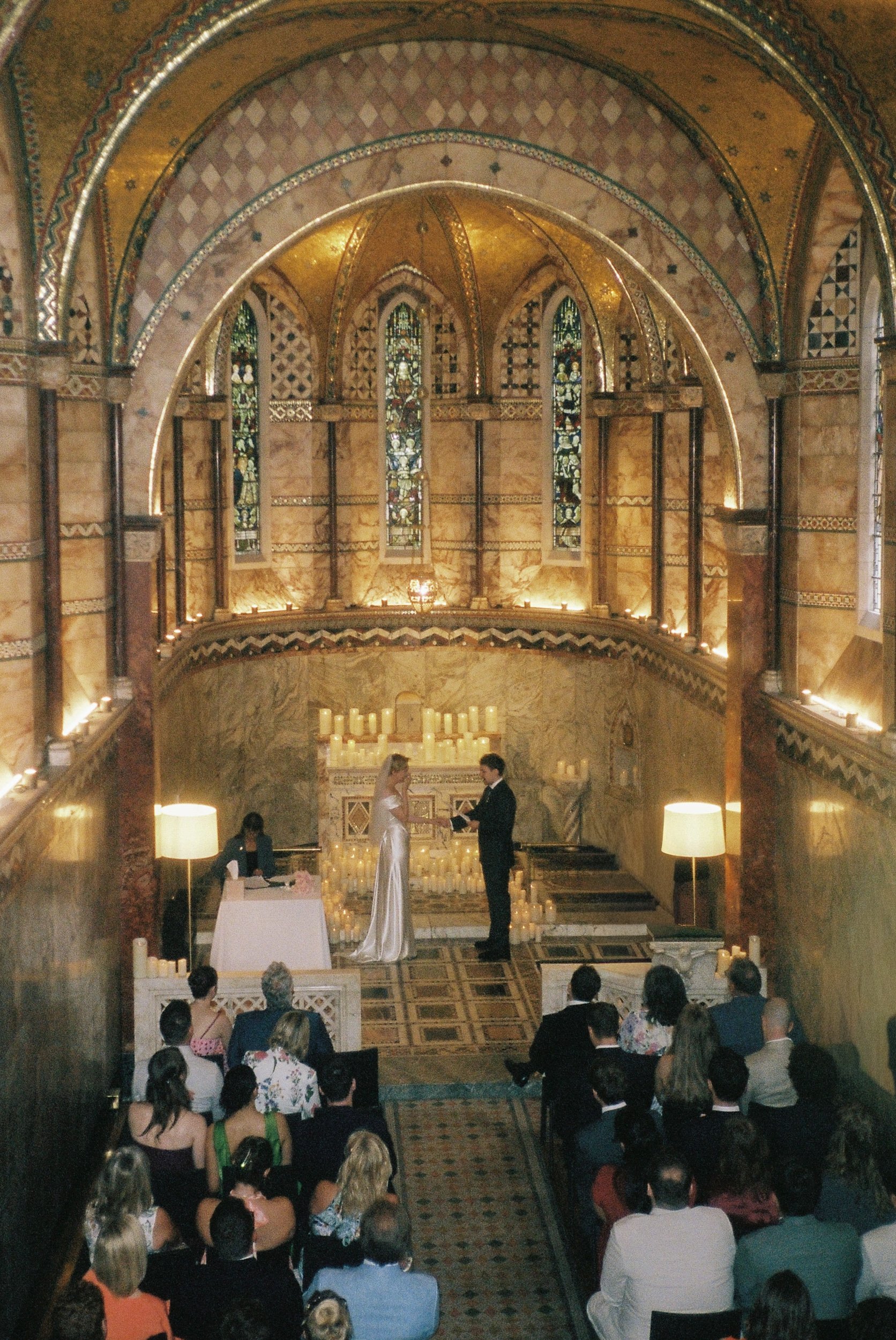 17-fitzrovia-chapel-wedding-london-vivienne-westwood-dress-ceremony-35mm-film-studio-faria.jpg
