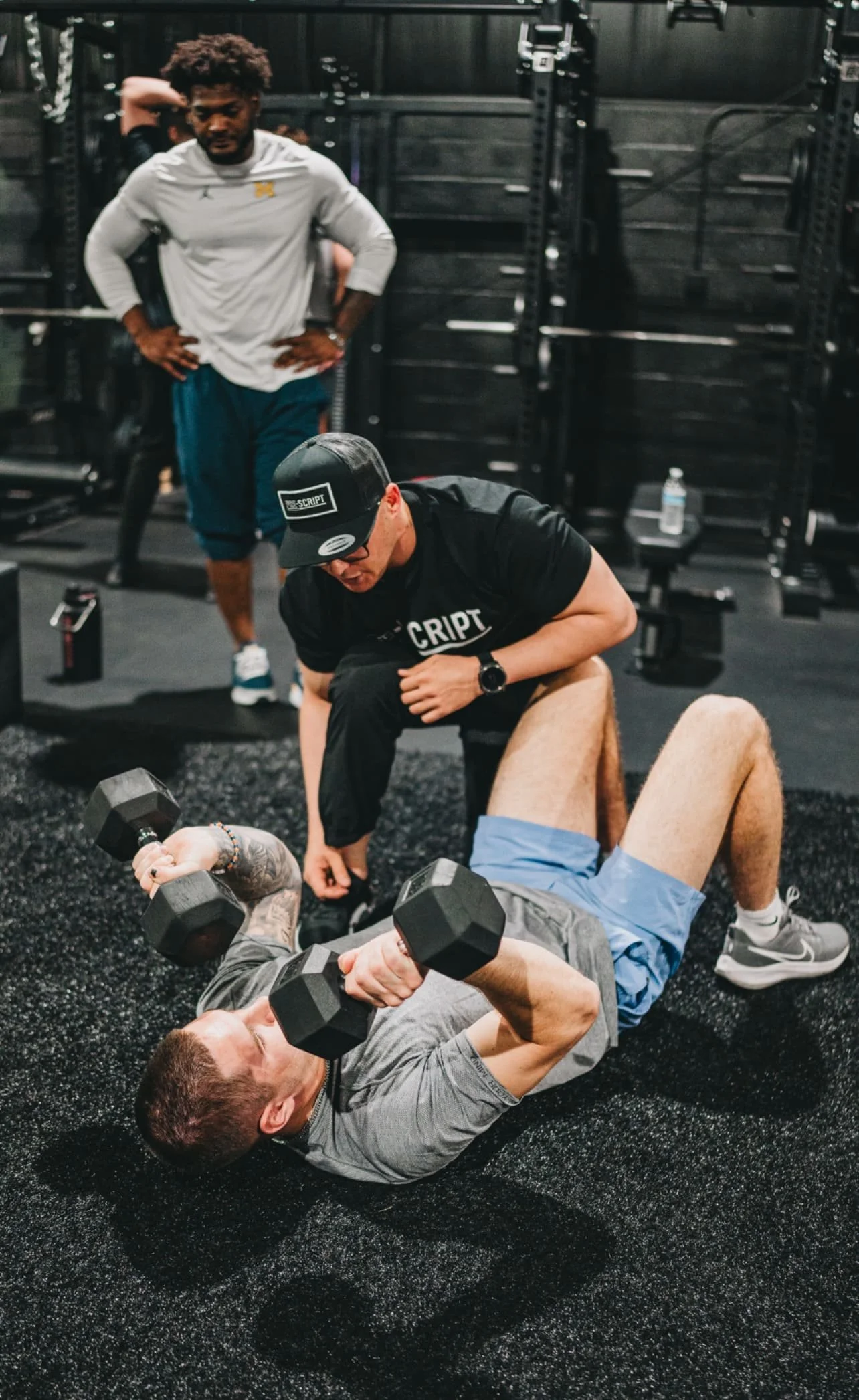 Anton teaching a client about form and technique for lifting