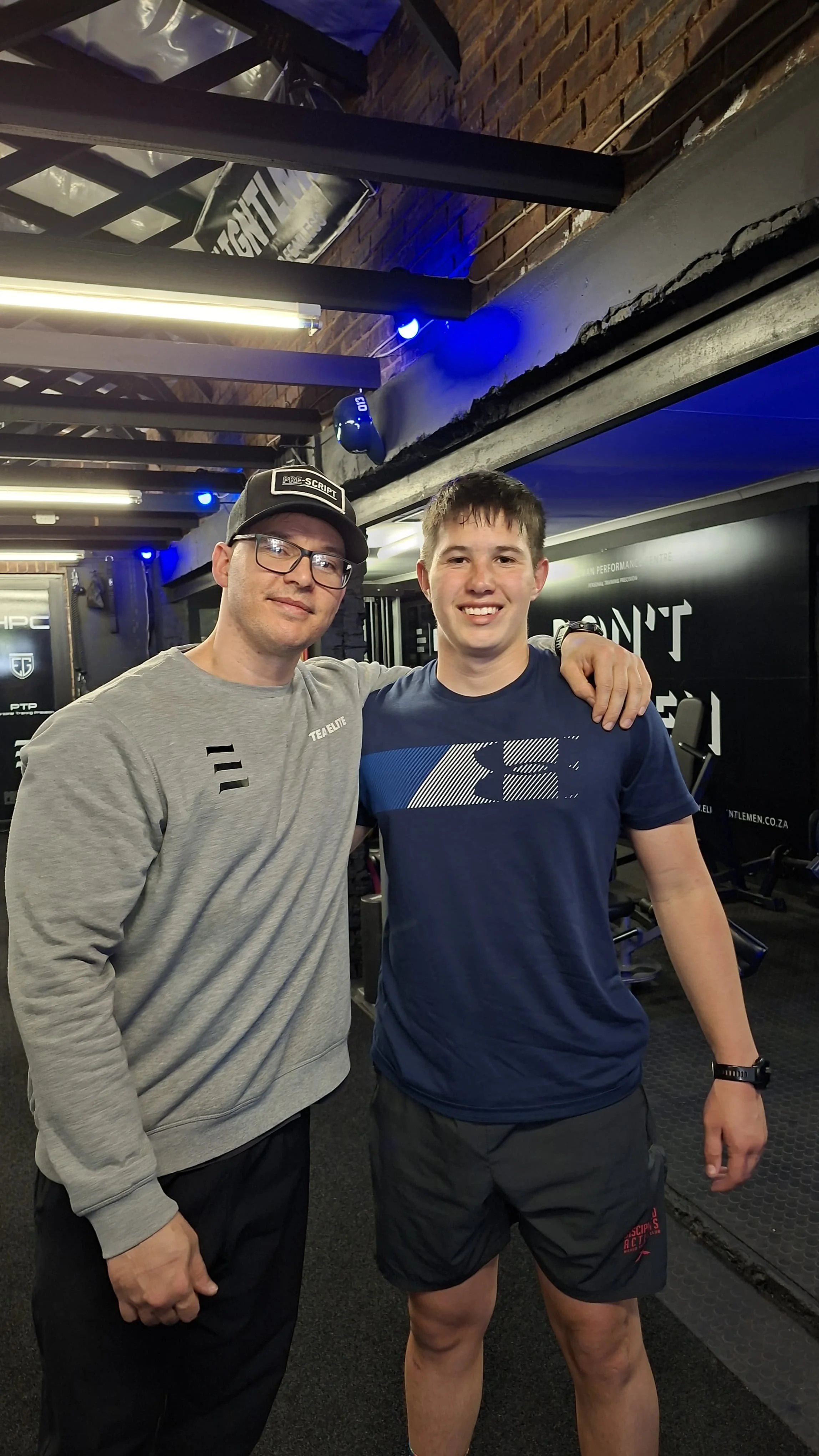 Anton Esterhuizen and Darius smiling at the HPC gym