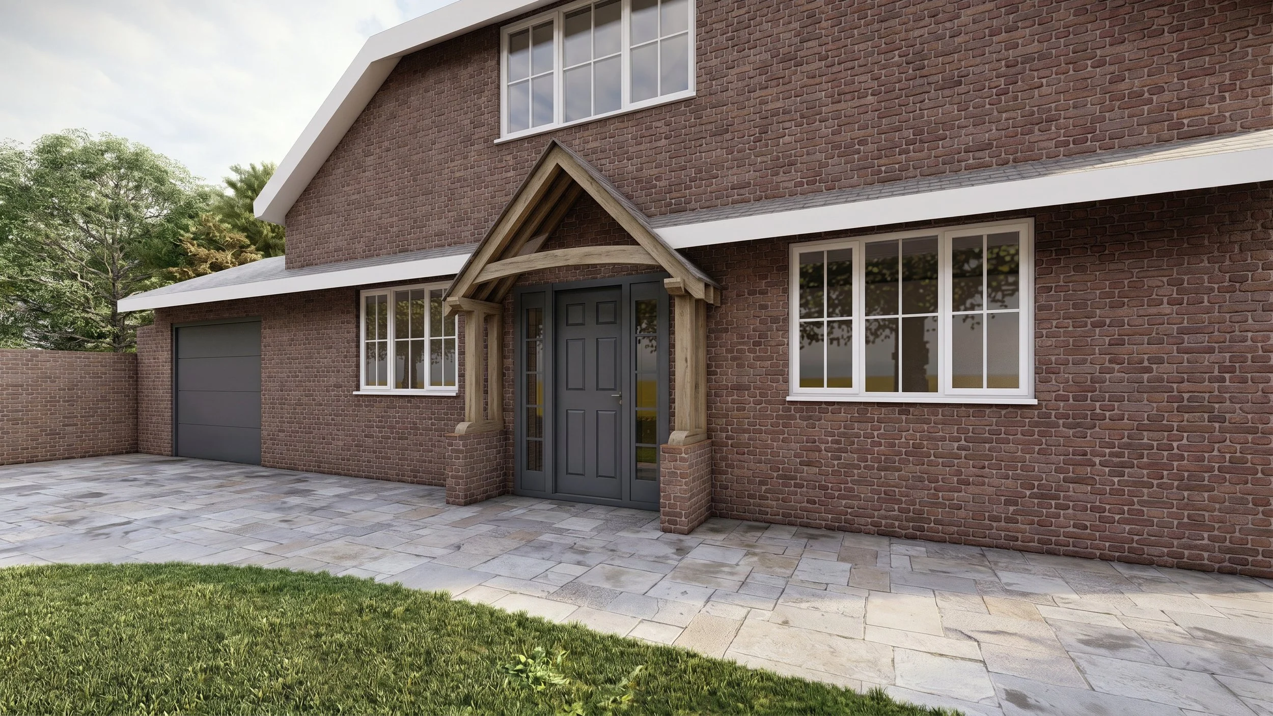 Front view of a brick house with a garage, front door with a small gabled wooden awning, large windows, stone pavement, and a grassy lawn with trees in the background.