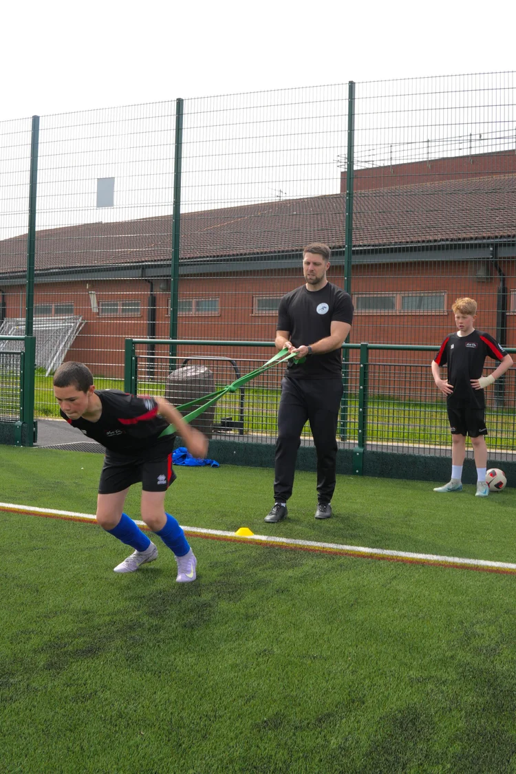 James coaching resisted sprints on a pitch