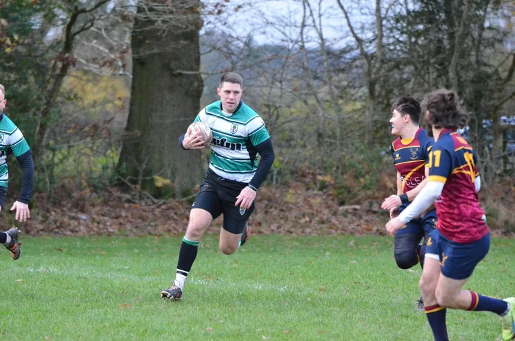 Rugby player running with the ball