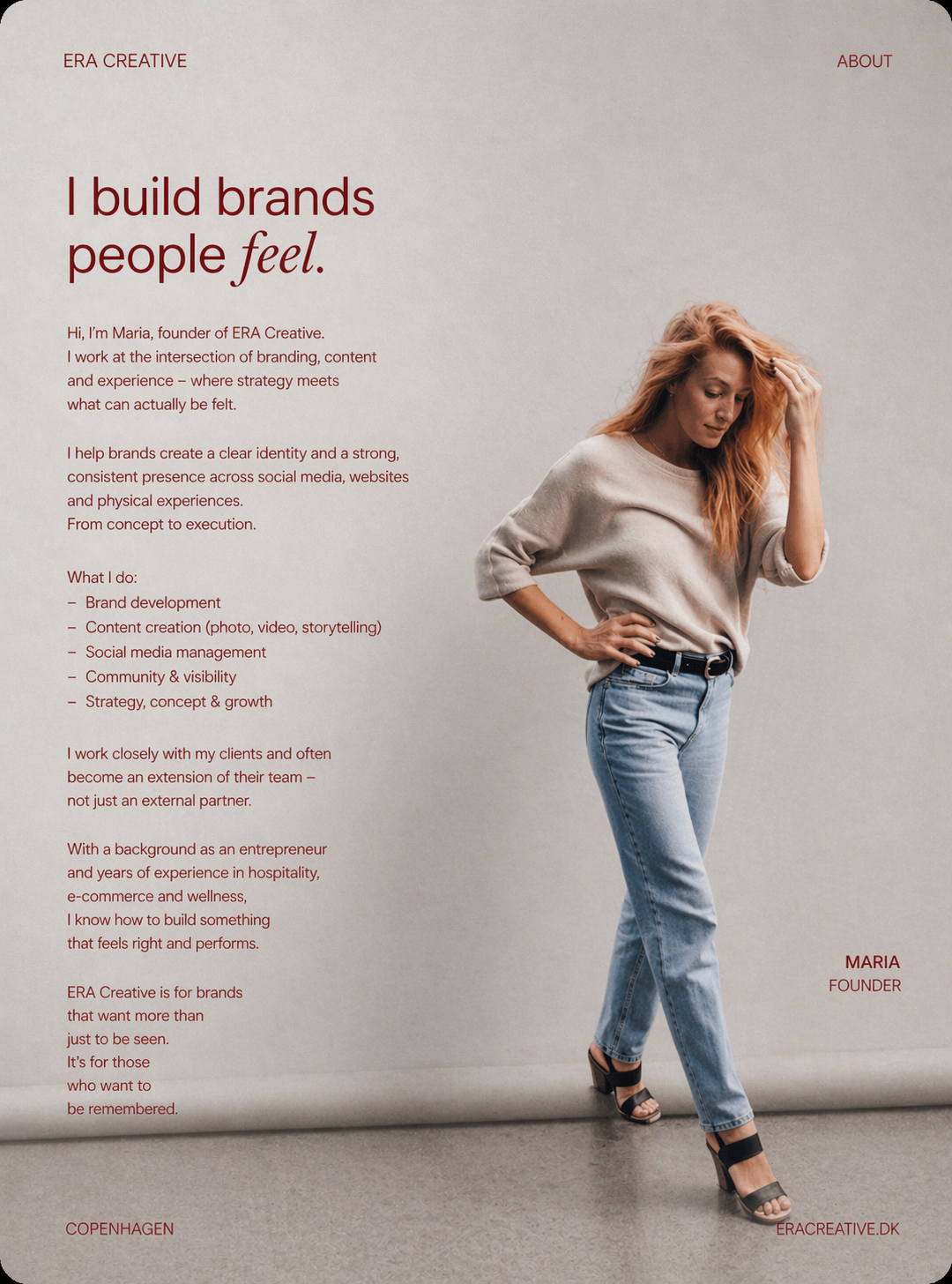 A woman with red hair, wearing a beige sweater and blue jeans, standing with one hand on her hip and the other touching her hair, next to a webpage explaining her branding and content creation services.
