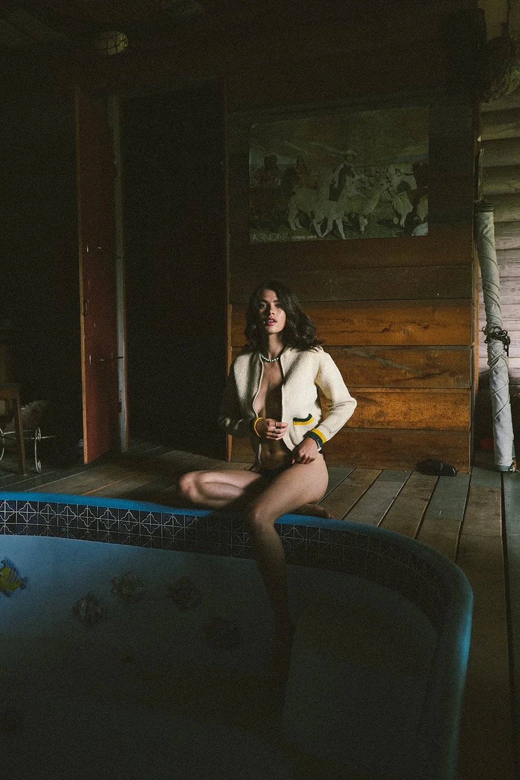 woman posing at edge of pool
