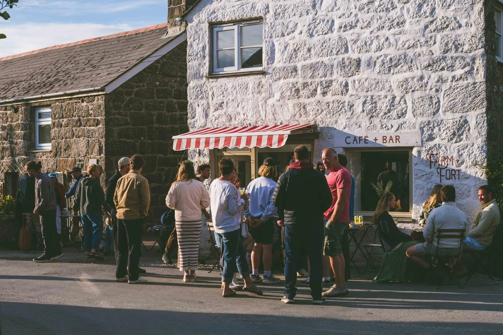 people outside farm and fort cafe, treen, cornwall