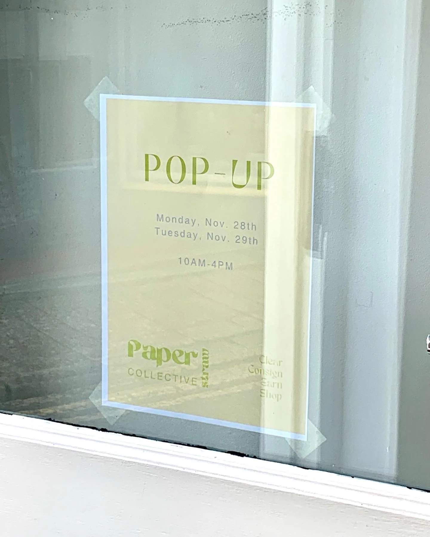 poster in window for pop up event
