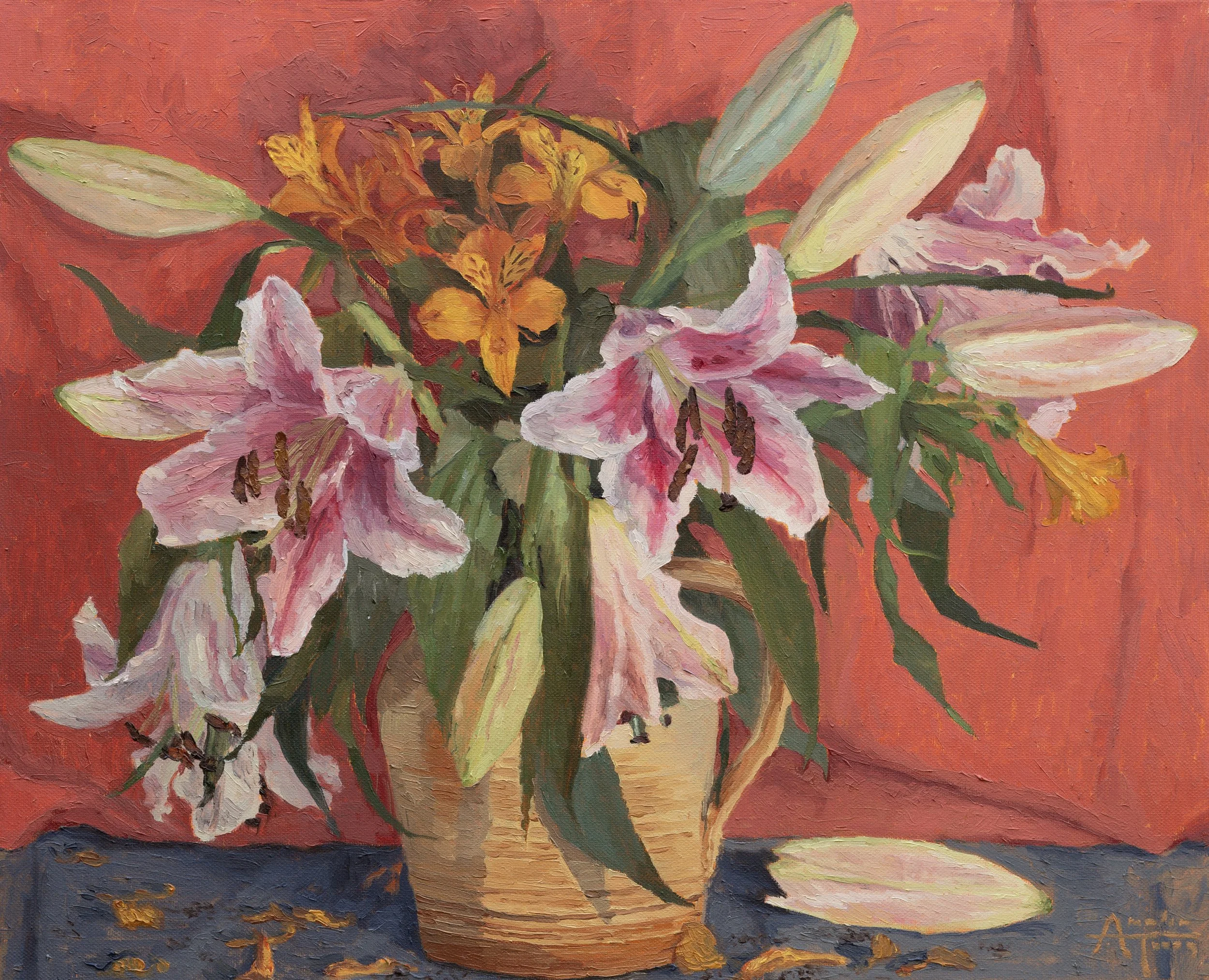 A still life painting of a bouquet of pink and white Lillies in pale yellow beige jug, placed on a slate blue cloth with a red cloth background. 
