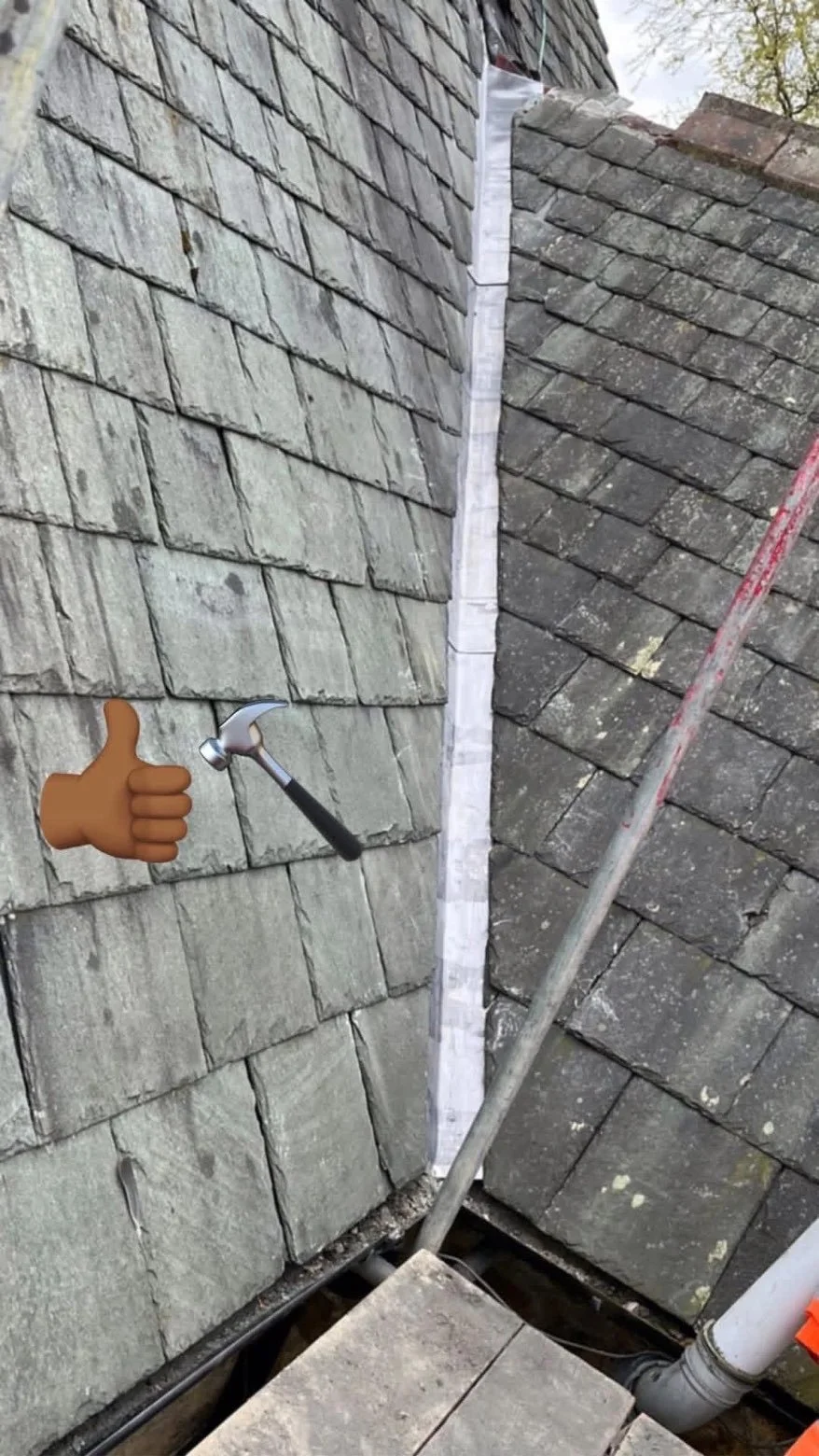 Close-up of roof shingles and a recently repaired or replaced flashing with a hammer and thumbs-up emoji overlay, indicating successful roofing work.