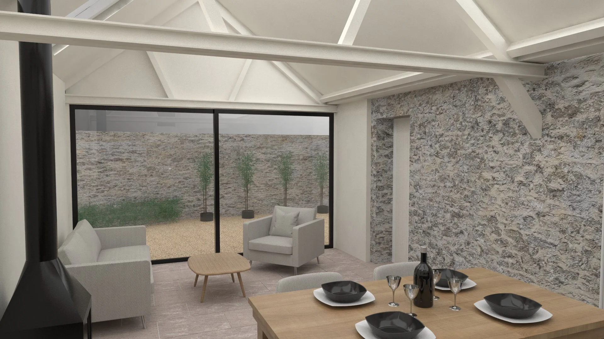 Modern living room with white furniture, a round coffee table, and a dining table set with black bowls, glasses, and wine bottles. Large glass sliding door opens to an outdoor patio with a stone wall and three potted plants.