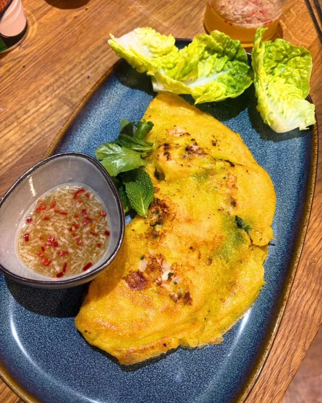 Not all pancakes are sweet.

This one&rsquo;s rice flour and turmeric, filled with prawns, beansprouts, onion and fresh herbs folded up and dipped into something sharp and salty on the side. B&aacute;nh x&egrave;o. Yum

Crispy, warm, slightly messy a